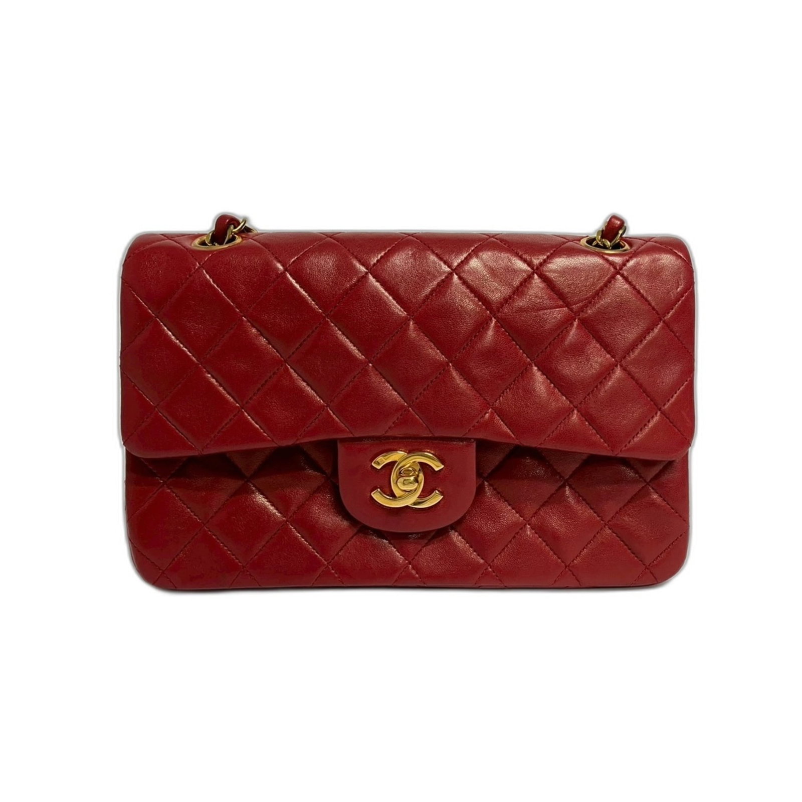 Shoulder Bag by Chanel: Shoulder Bag by Chanel The iconic Matelasse shoulder bag from Chanel boasts a striking red color, perfectly capturing the essence of timeless elegance. Measuring 14cm x 23cm x 7cm, this compact yet