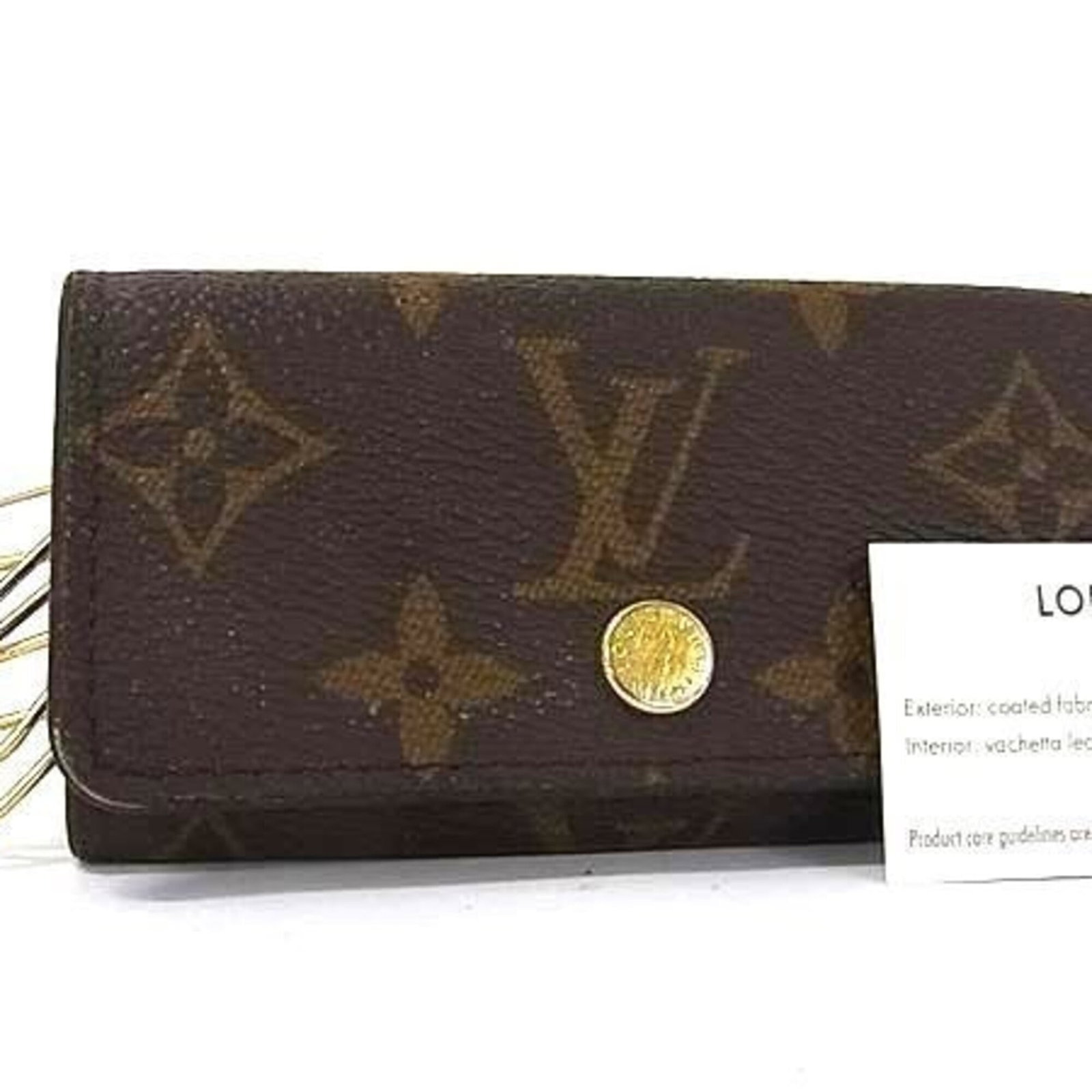 Vuitton Louis Keycase Monogram: Vuitton Louis Keycase Monogram Brown Monogram Louis Vuitton Keycase with RFID Serial Number. This compact keycase features the iconic monogram pattern and has four key hooks for convenient storage. Ma