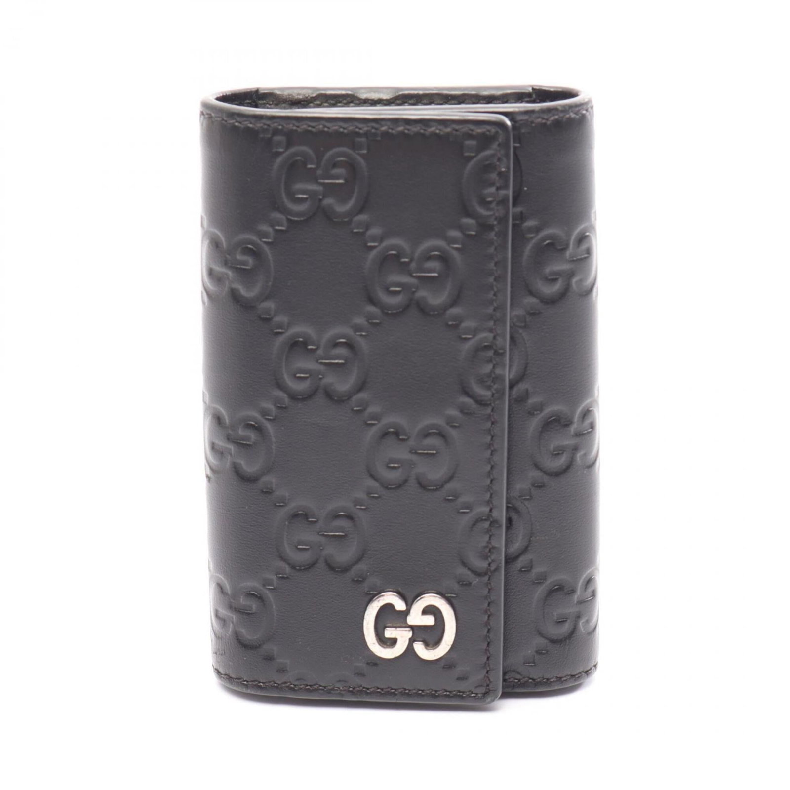 Keycase Leather by Gucci: Keycase Leather by Gucci Keycase Leather by Gucci is made from high-quality black leather, measuring 11cm x 7.5cm x 2cm in size. This stylish keycase bears a signature and features the iconic Gucci br