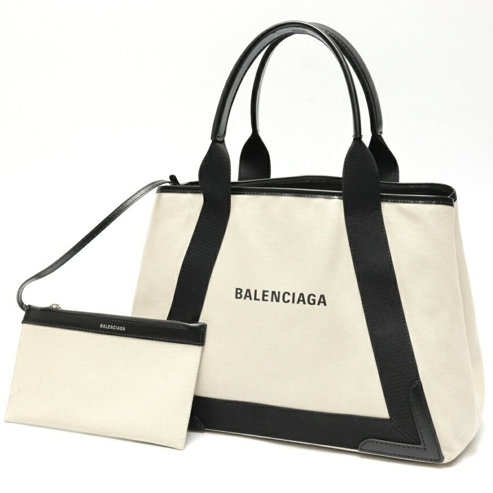 Canvas leather bag tote by Balenciaga: Canvas leather bag tote by Balenciaga Canvas leather bag tote by Balenciaga, featuring canvas and leather construction in black. This stylish tote measures 27cm x 35cm x 17cm and boasts a sleek design