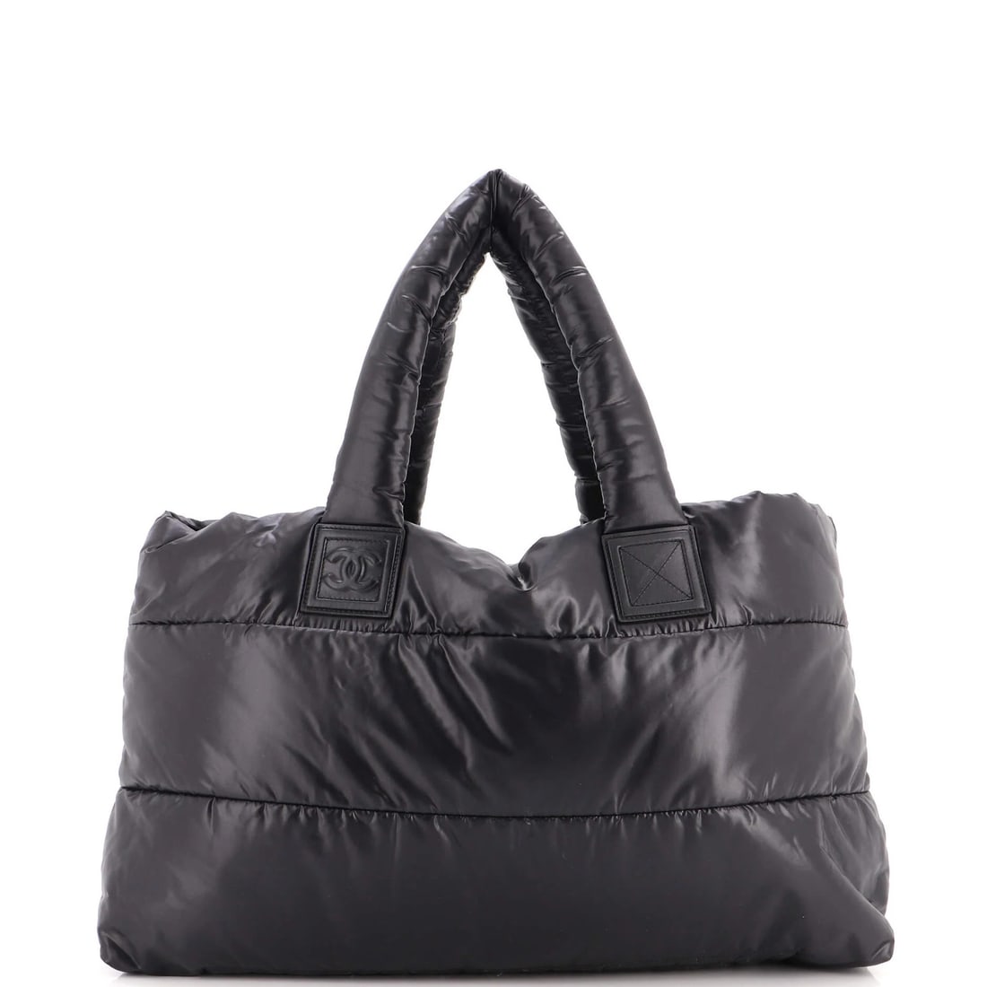 Chanel Coco Cocoon Reversible Tote Quilted Nylon Large: Chanel Coco Cocoon Reversible Tote Quilted Nylon Large Black quilted nylon exterior, featuring the iconic Coco Cocoon design, with reversible functionality and silver hardware. Measures 15" high, 18"