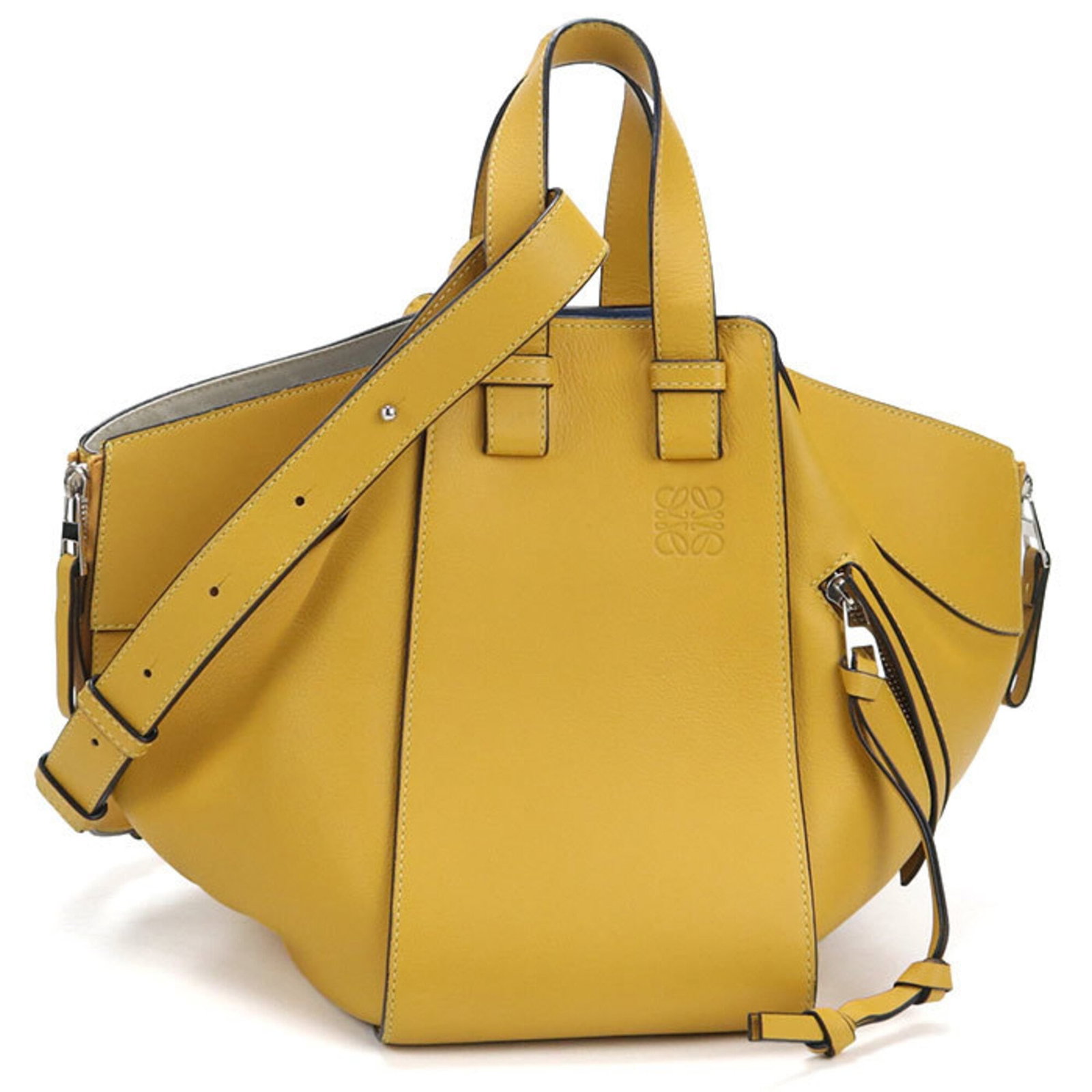 Loewe Handbag Leather: Loewe Handbag Leather This beautiful Loewe handbag features high-quality yellow calfskin leather and sleek silver hardware, showcasing the brand's signature style. Measuring 23cm x 14cm x 24cm, it mak