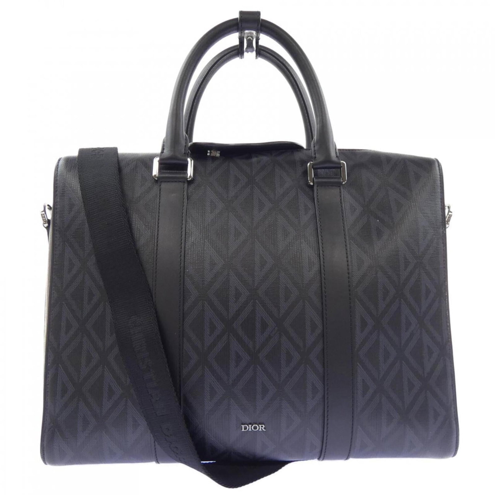Handbag by Christian Dior: Handbag by Christian Dior This black and gray Christian Dior handbag measures 27cm x 35cm x 8cm, offering a sleek and sophisticated design. The bag's dimensions provide ample space for daily essential