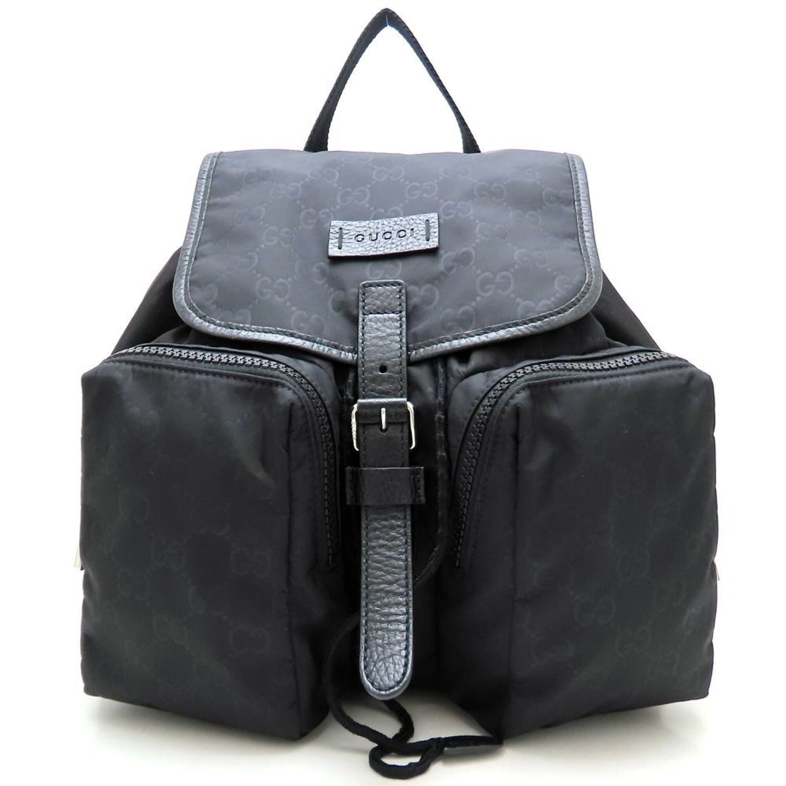 Nylon Leather Backpack by Gucci: Nylon Leather Backpack by Gucci Nylon Leather Backpack by Gucci - A stylish and functional accessory, this backpack features a durable nylon exterior with premium leather accents in black. The sleek d