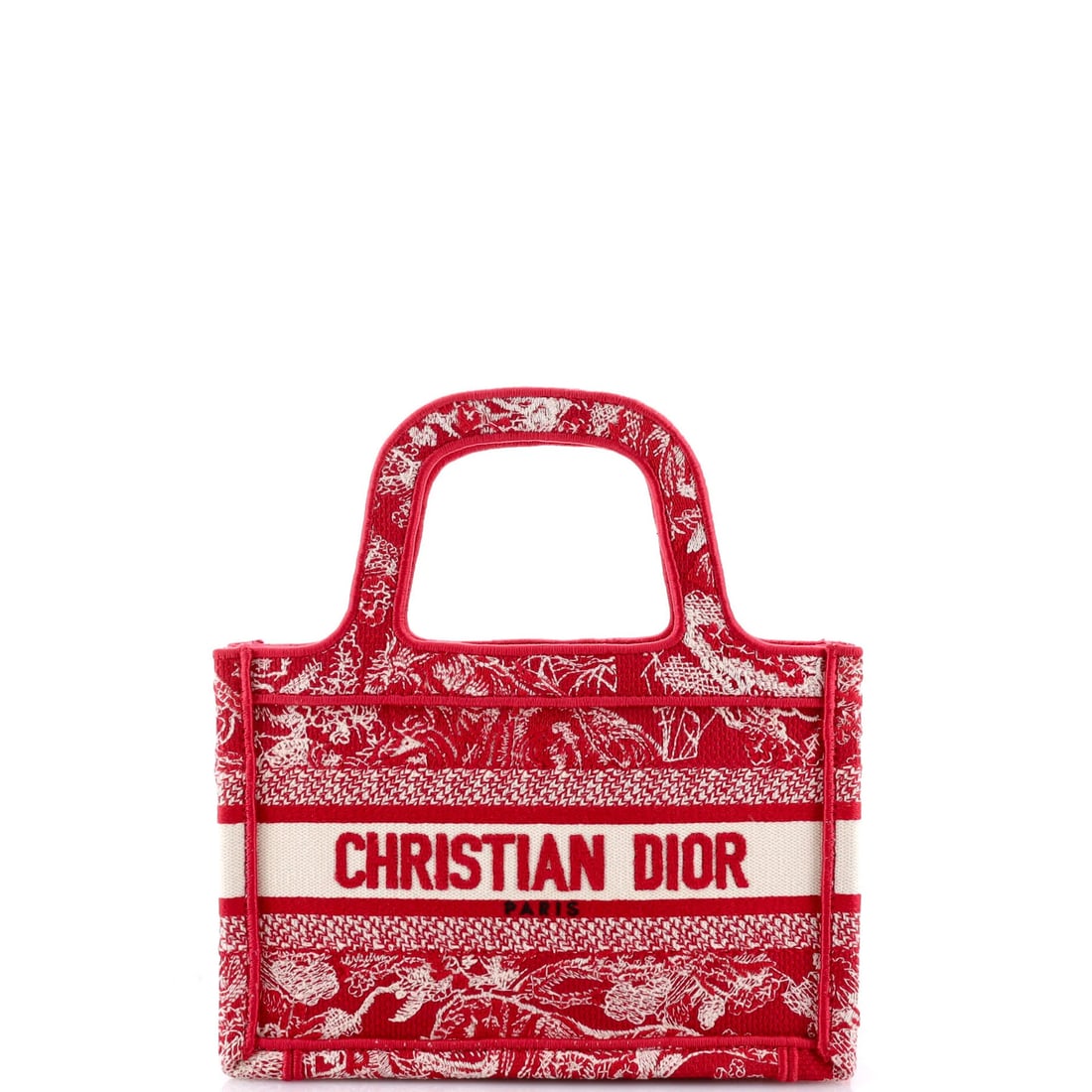 Canvas tote book embroidered mini by Christian Dior: Canvas tote book embroidered mini by Christian Dior Canvas tote book embroidered mini by Christian Dior, featuring a striking red exterior with subtle scuffs and edge wear. The interior boasts