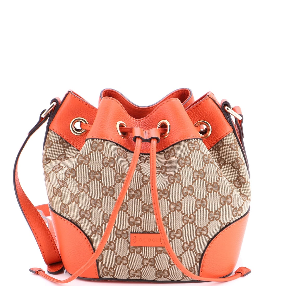 GG Canvas Bag Leather Medium Gucci Bucket Classic: GG Canvas Bag Leather Medium Gucci Bucket Classic The Gucci Bucket Classic Medium bag boasts a striking orange exterior, complemented by a neutral interior and gold-tone hardware. Crafted from canvas-