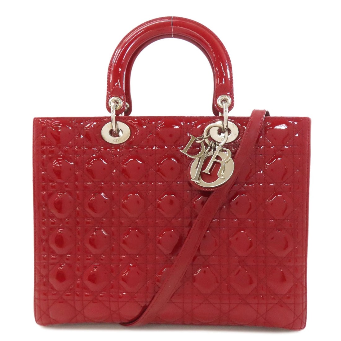 Handbag Enamel Christian Dior 2Way: Handbag Enamel Christian Dior 2Way Red enamel handbag with Christian Dior's iconic 2Way style, showcasing the brand's signature two-way closure. This vibrant red bag features an enamel exterior that