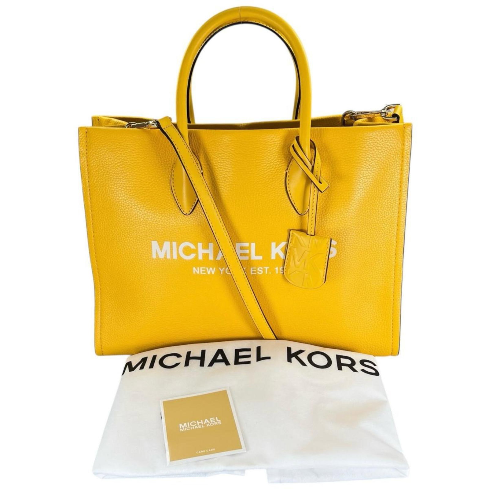 Michael Kors Shoulder Bag: Michael Kors Shoulder Bag This vibrant yellow Michael Kors shoulder bag boasts an open outer pocket for added convenience. Measuring 22cm x 31cm x 12cm, it features a sturdy design with a clochette an