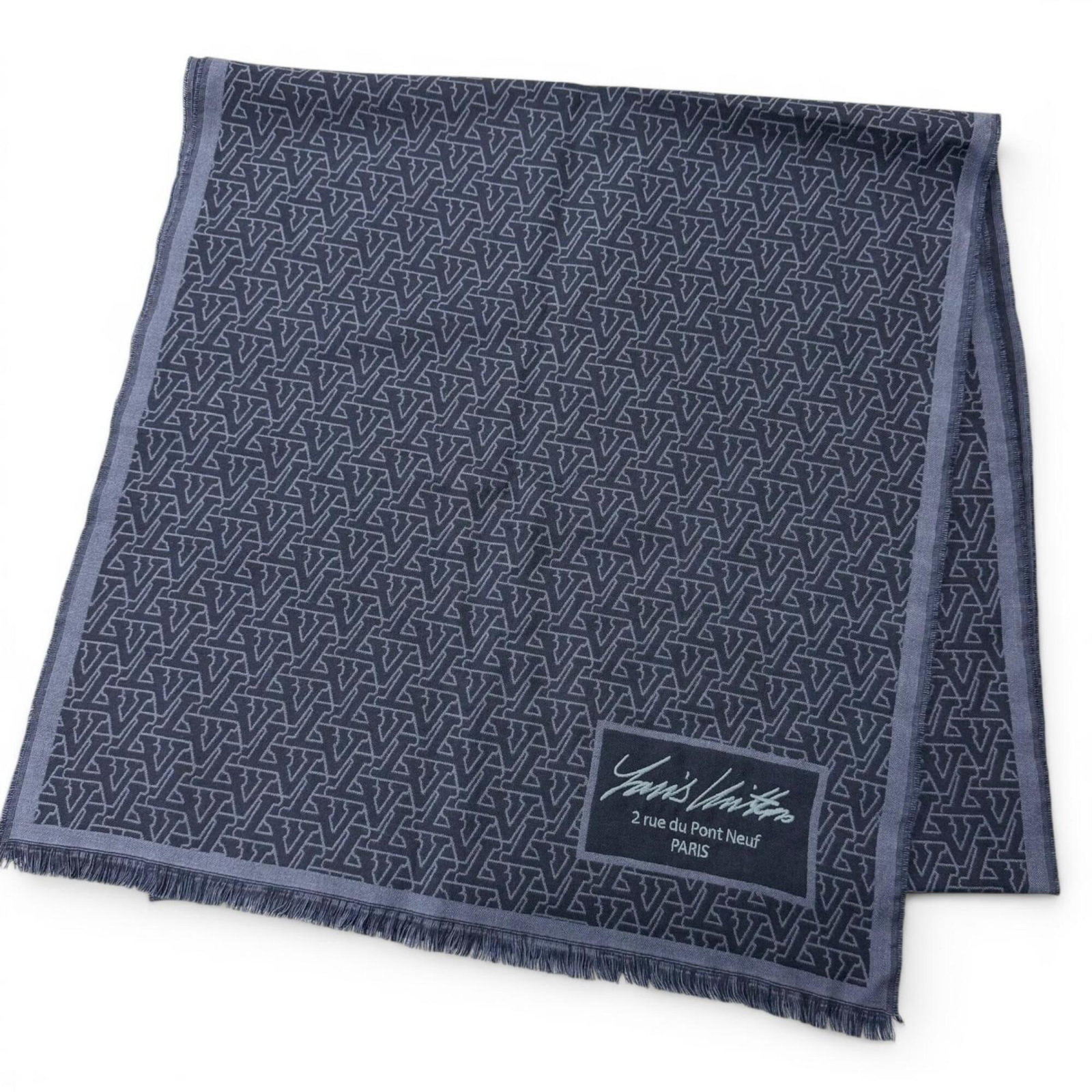 Silk stole by Louis Vuitton: Silk stole by Louis Vuitton Silk stole by Louis Vuitton, measuring 1.96m x 47.5cm in navy color with a blend of wool and silk material. This stylish piece bears the signature of the renowned brand,