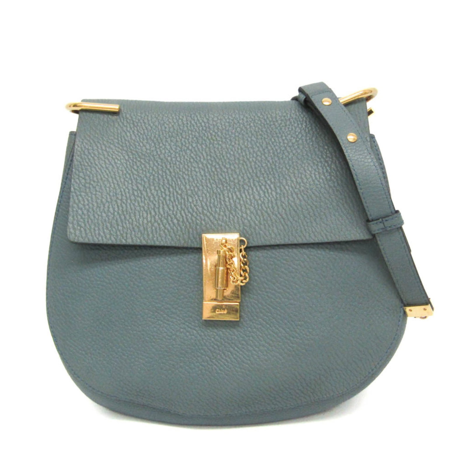 Shoulder bag leather chlo: Shoulder bag leather chlo Light blue leather shoulder bag with gold hardware, featuring a turn lock closure and open pockets. The bag measures 24cm x 27cm x 8.5cm and has a strap length of 93-110cm, w