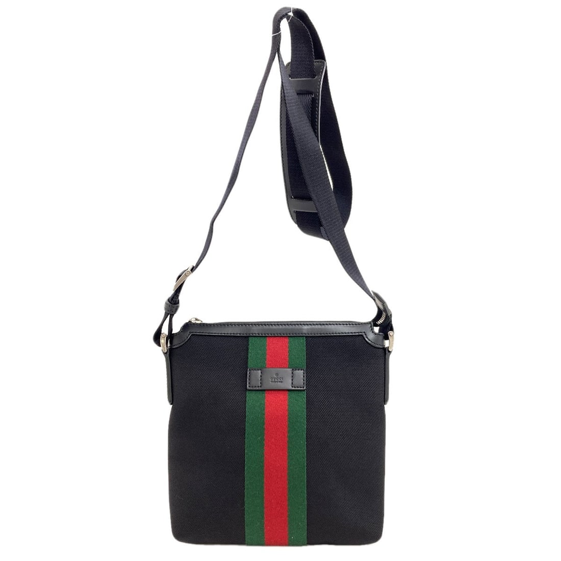 Nylon canvas shoulder bag nylon sherry gucci outlet line 631195: Nylon canvas shoulder bag nylon sherry gucci outlet line 631195 Black nylon canvas shoulder bag with a classic design, featuring the iconic GUCCI brand. This stylish bag boasts a sleek black exterior 