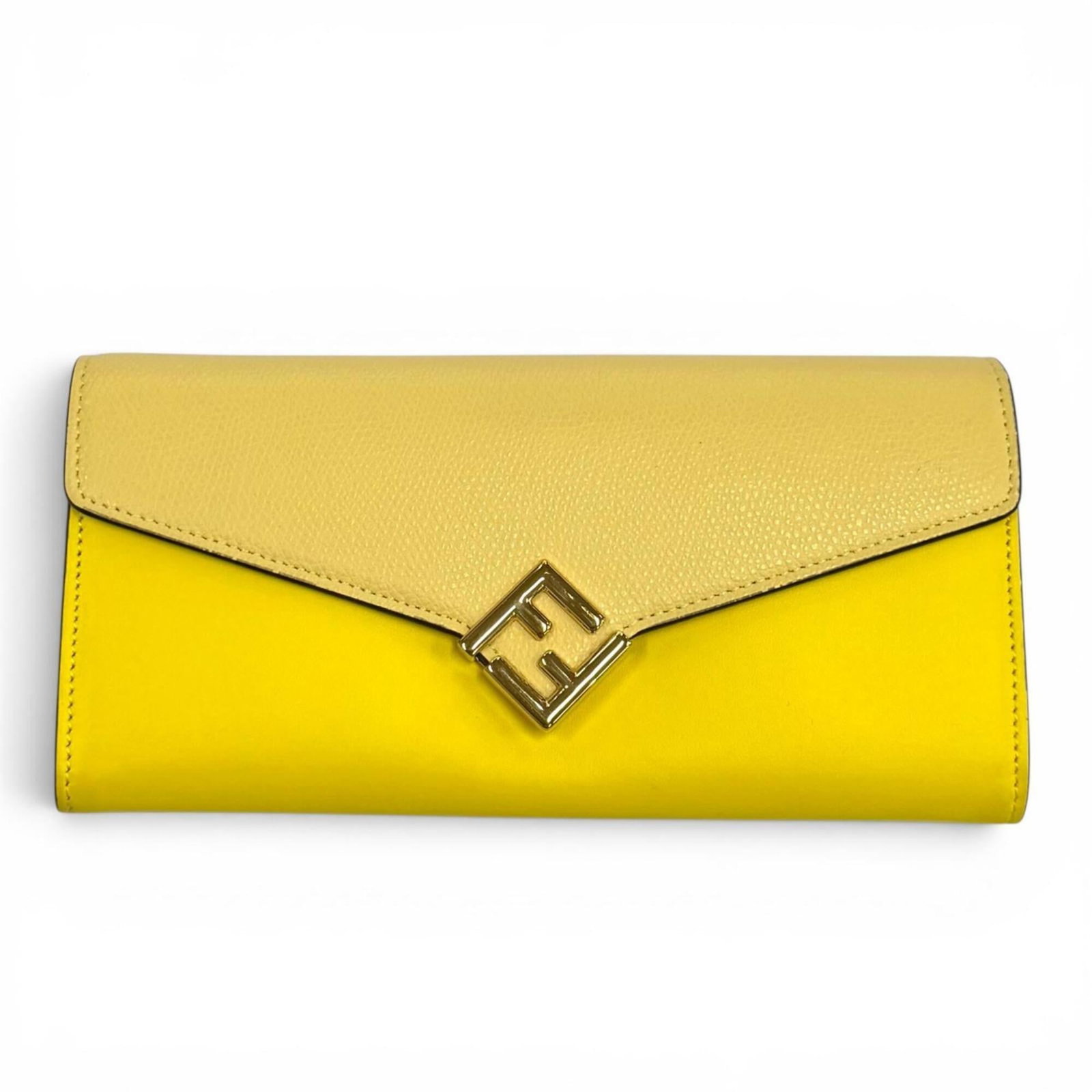 FENDI LEATHER WALLET BI FOLD: FENDI LEATHER WALLET BI FOLD Fendi's iconic leather wallet features a bright and sunny yellow hue, adding a pop of color to any outfit. The bi-fold design provides ample space for cards and cash, whil