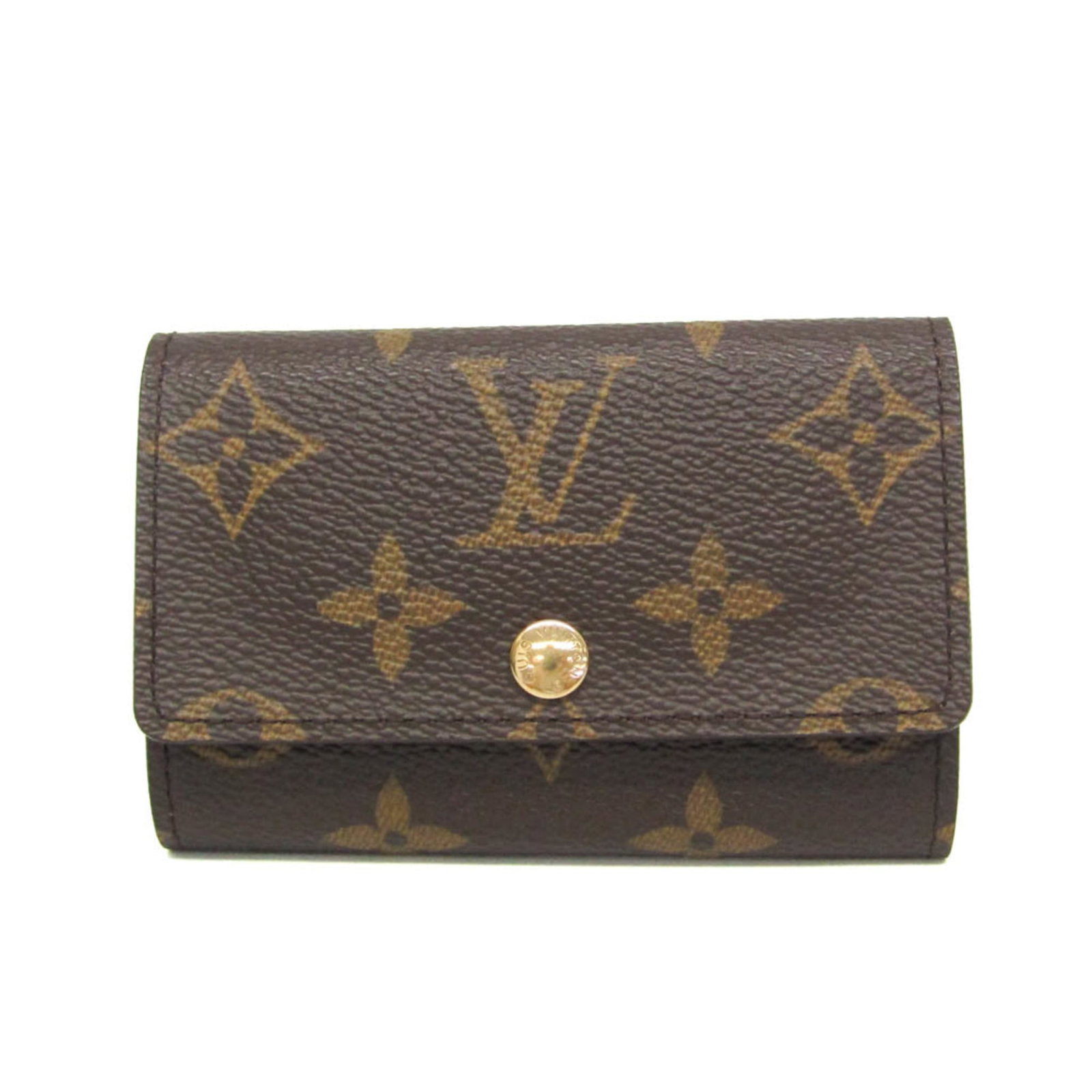 Vuitton Louis Keycase Monogram: Vuitton Louis Keycase Monogram The iconic Louis Vuitton Monogram Keycase, crafted in rich brown leather with the signature interlocking M pattern. This functional key holder features six secure hooks
