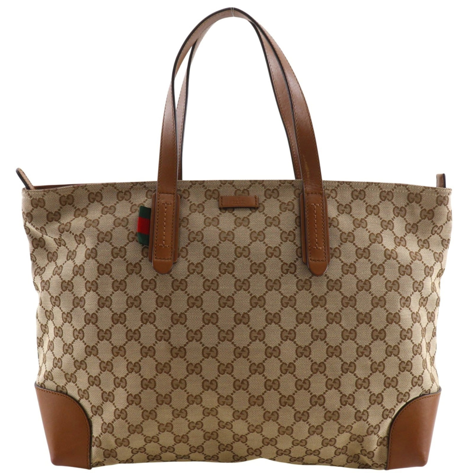 Canvas bag Gg by Gucci: Canvas bag Gg by Gucci Gucci's GG canvas tote bag features the iconic interlocking double-G logo in brown, showcasing the brand's signature style. Made from high-quality GG canvas, this versatile bag 