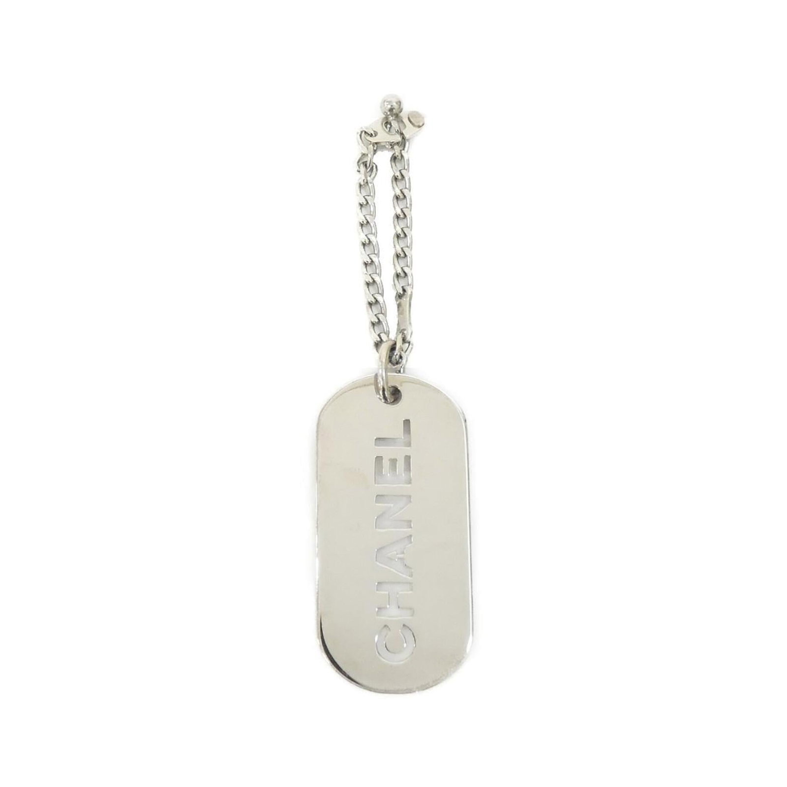 Keyring by Chanel: Keyring by Chanel Silver Chanel keyring with MPN 25216. This stylish accessory bears the iconic brand's signature design, adding a touch of luxury to any outfit. A simple yet elegant piece that showca