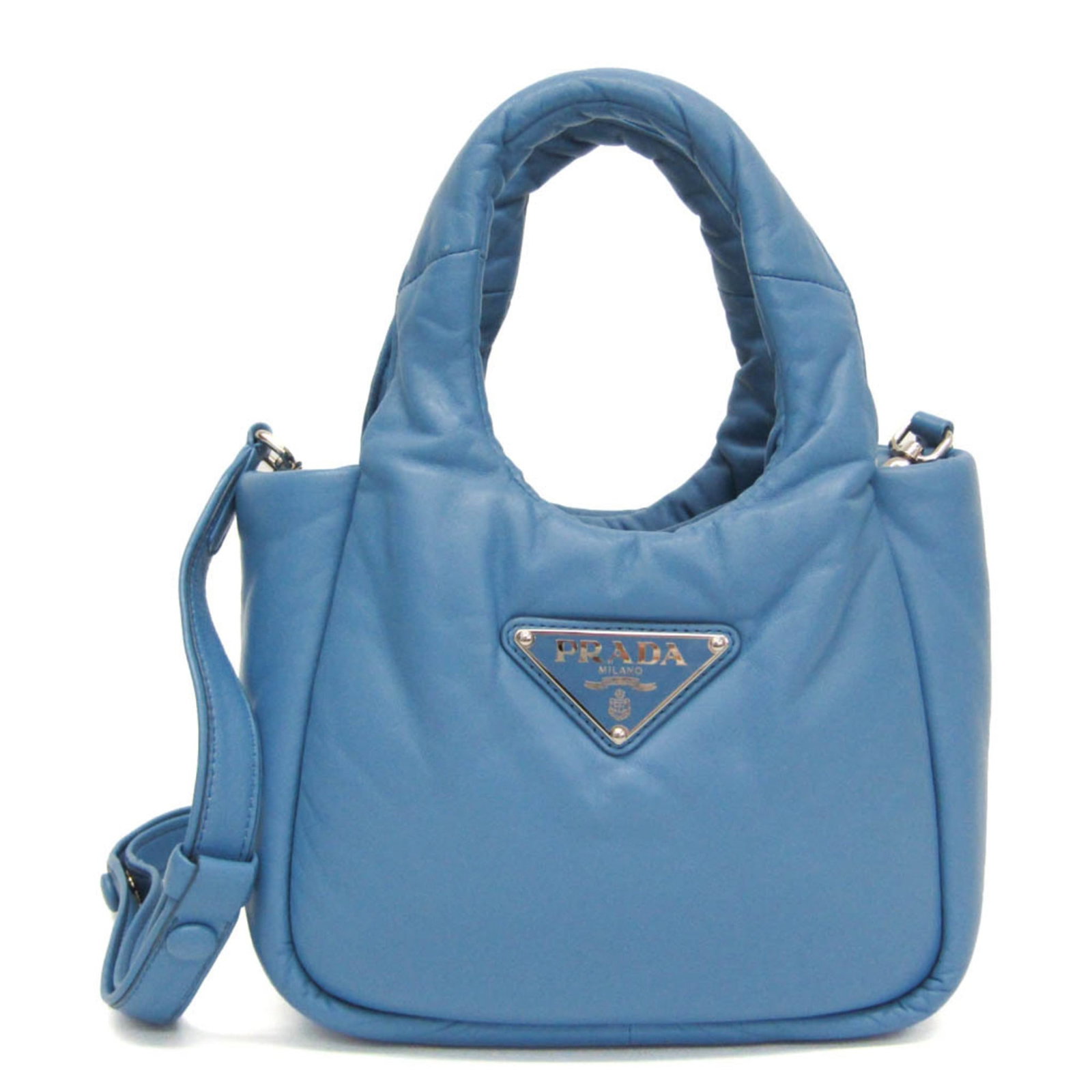 Prada Handbag Shoulder Bag Nappa Leather: Prada Handbag Shoulder Bag Nappa Leather Prada's iconic Padded shoulder bag boasts sleek, modern design with a rich blue hue. Crafted from high-quality nappa leather, the bag features an open pocket a