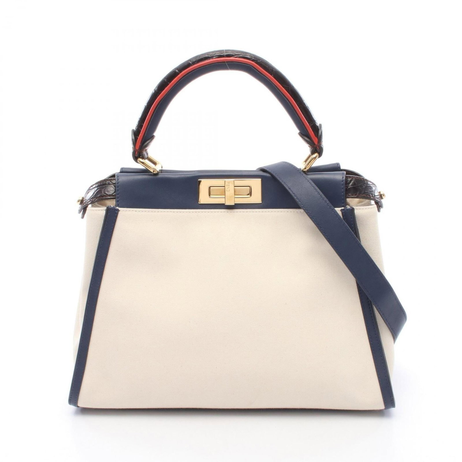 Handbag Canvas Knit by Fendi: Handbag Canvas Knit by Fendi Canvas Knit by Fendi features a unique blend of canvas and knit materials in three striking colors: Ivory, Navy, and Red. This stylish handbag measures 24cm x 34cm x 13cm,