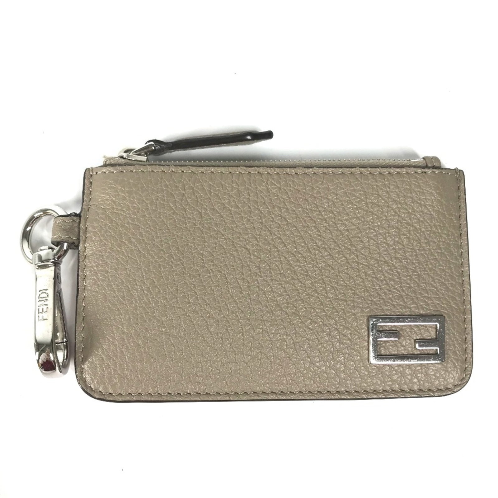 Coin purse leather case by Fendi: Coin purse leather case by Fendi Leather coin purse case by Fendi, featuring a classic beige color and elegant design. Made from high-quality leather, this compact case measures 12cm x 7cm (4.7" x