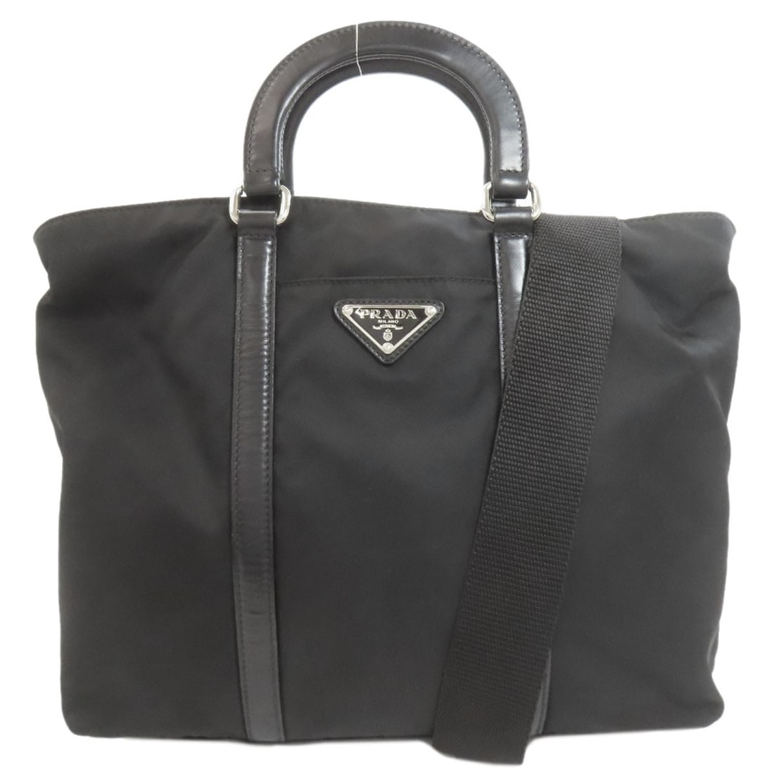 Logo Hardware Handbag Nylon Prada 2Way: Logo Hardware Handbag Nylon Prada 2Way Black Logo Hardware Handbag Made from Nylon. This Prada handbag features a black exterior with logo hardware, showcasing the brand's signature style. The nylon m