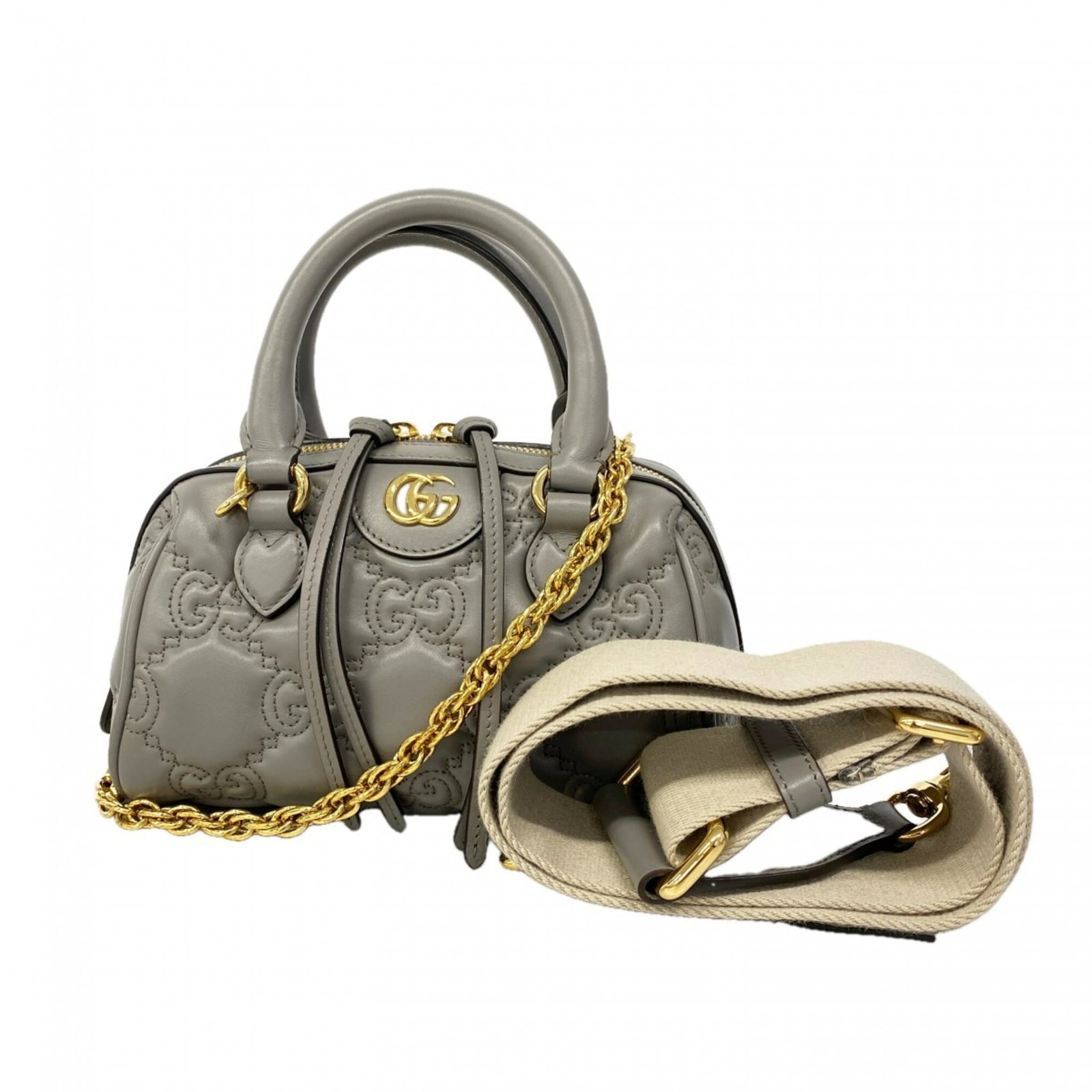Gucci Handbag Leather: Gucci Handbag Leather The Gucci handbag leather features a sleek gray color and gold hardware, adding a touch of sophistication to its design. Made from high-quality leather, the bag measures 15cm x