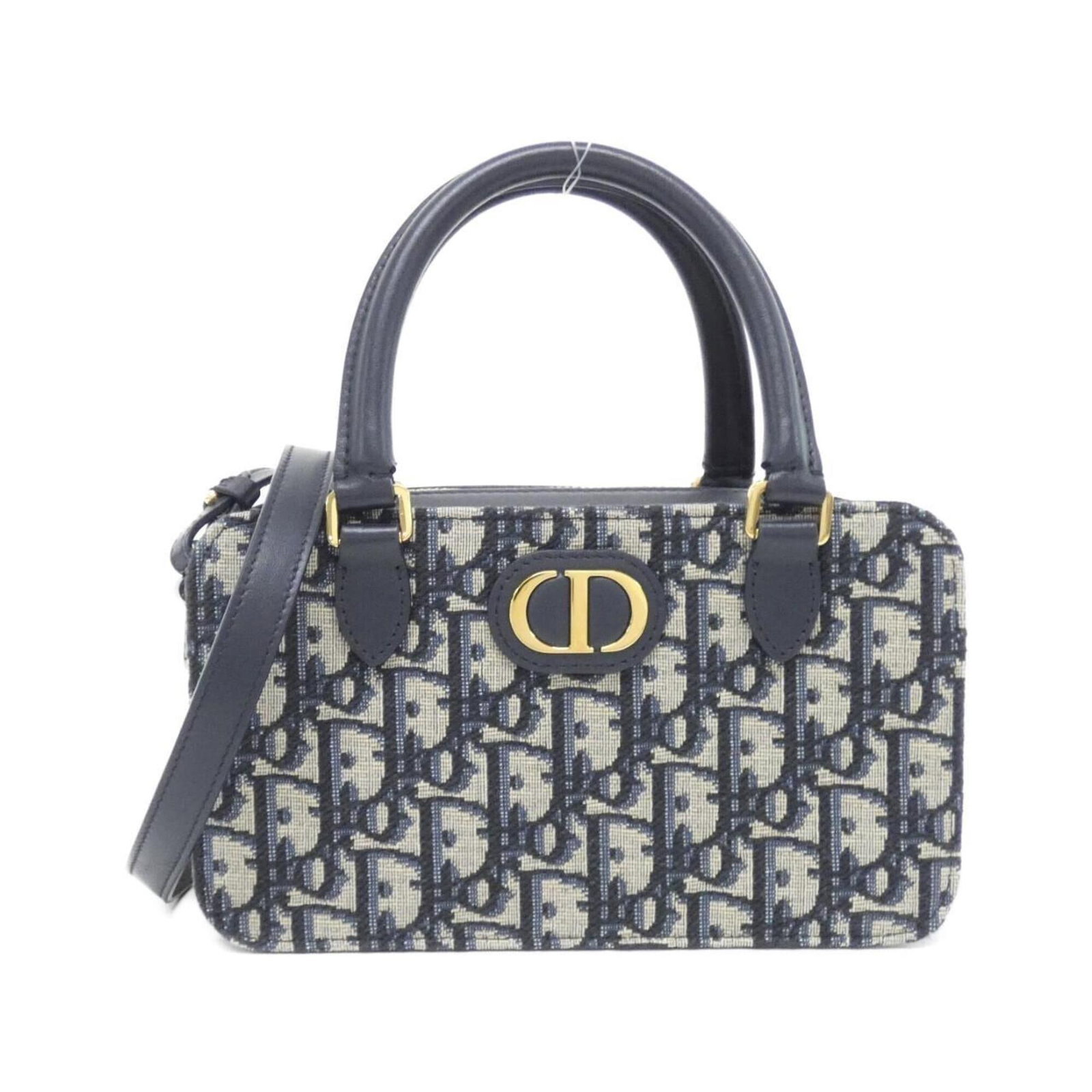Canvas by Dior Christian: Canvas by Dior Christian Canvas by Dior Christian - A stylish and compact canvas handbag with a blue hue and gold hardware, measuring 11cm x 20cm x 8cm. The bag's canvas material provides a unique tex