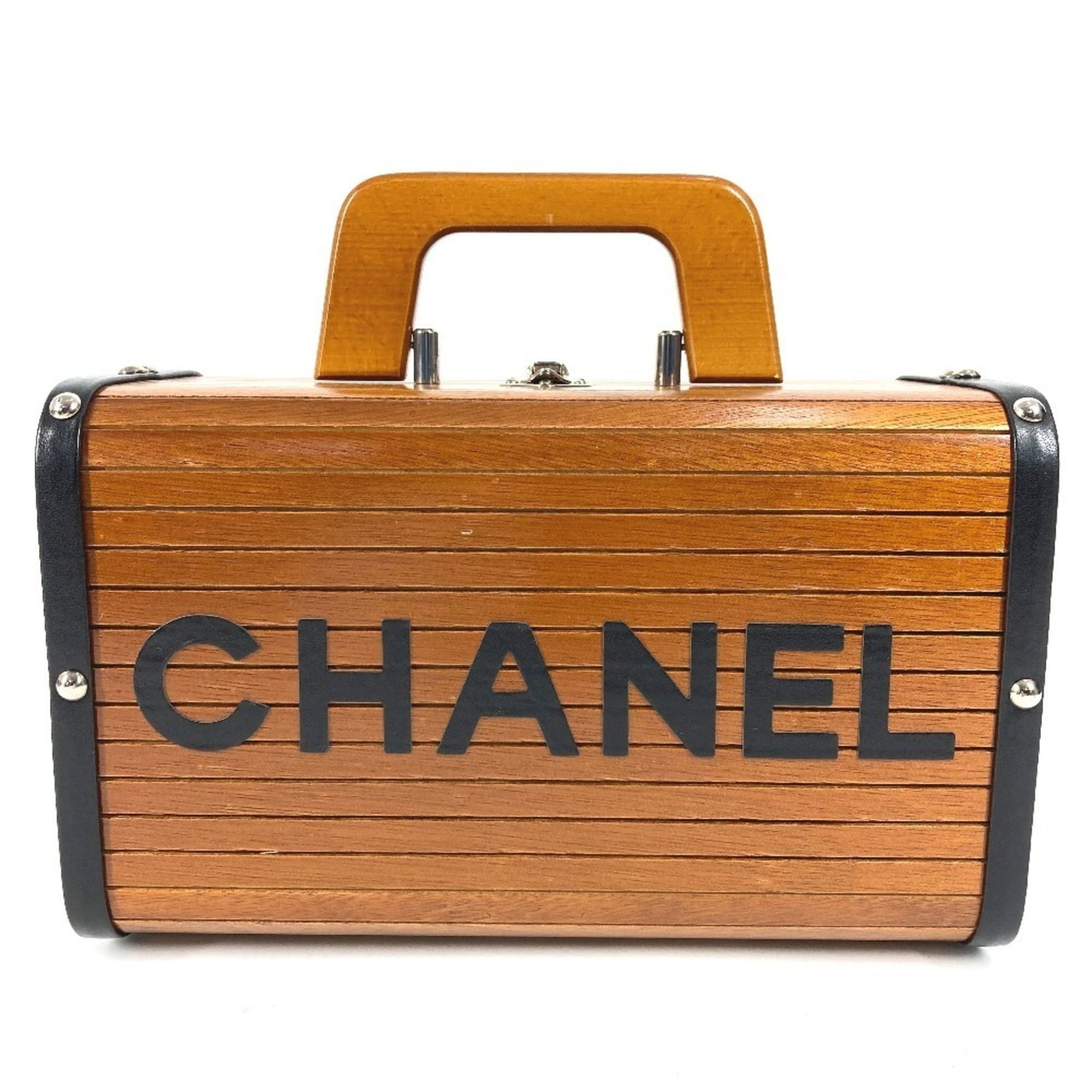Handbag wood vanity bag Chanel: Handbag wood vanity bag Chanel Black and Brown Wood Vanity Bag from Chanel, measuring 15cm x 25cm x 12cm. This wooden handbag features a unique design with contrasting black and brown wood tones.