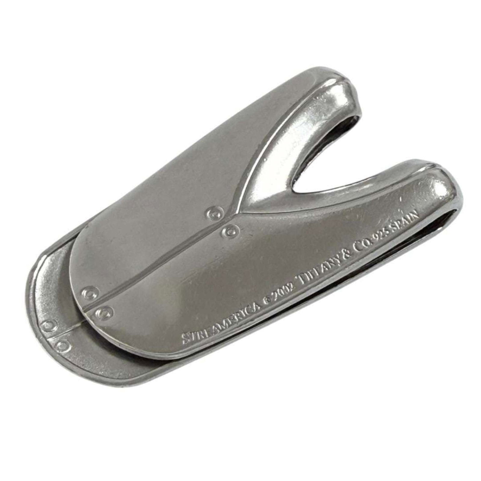 Tiffany clip silver 925 Money: Tiffany clip silver 925 Money Silver Tiffany clip money clip from Italy, made with 925 sterling silver and bearing a signature. This vintage piece measures 4.9cm x 2.5cm and features a classic design.