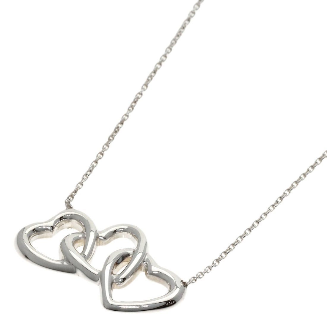 Triple Heart Silver Necklace by Tiffany & Co: Triple Heart Silver Necklace by Tiffany & Co Triple Heart Silver Necklace by Tiffany & Co. stands out with its sleek, silver design and classic style. Made from high-quality silver metal, this