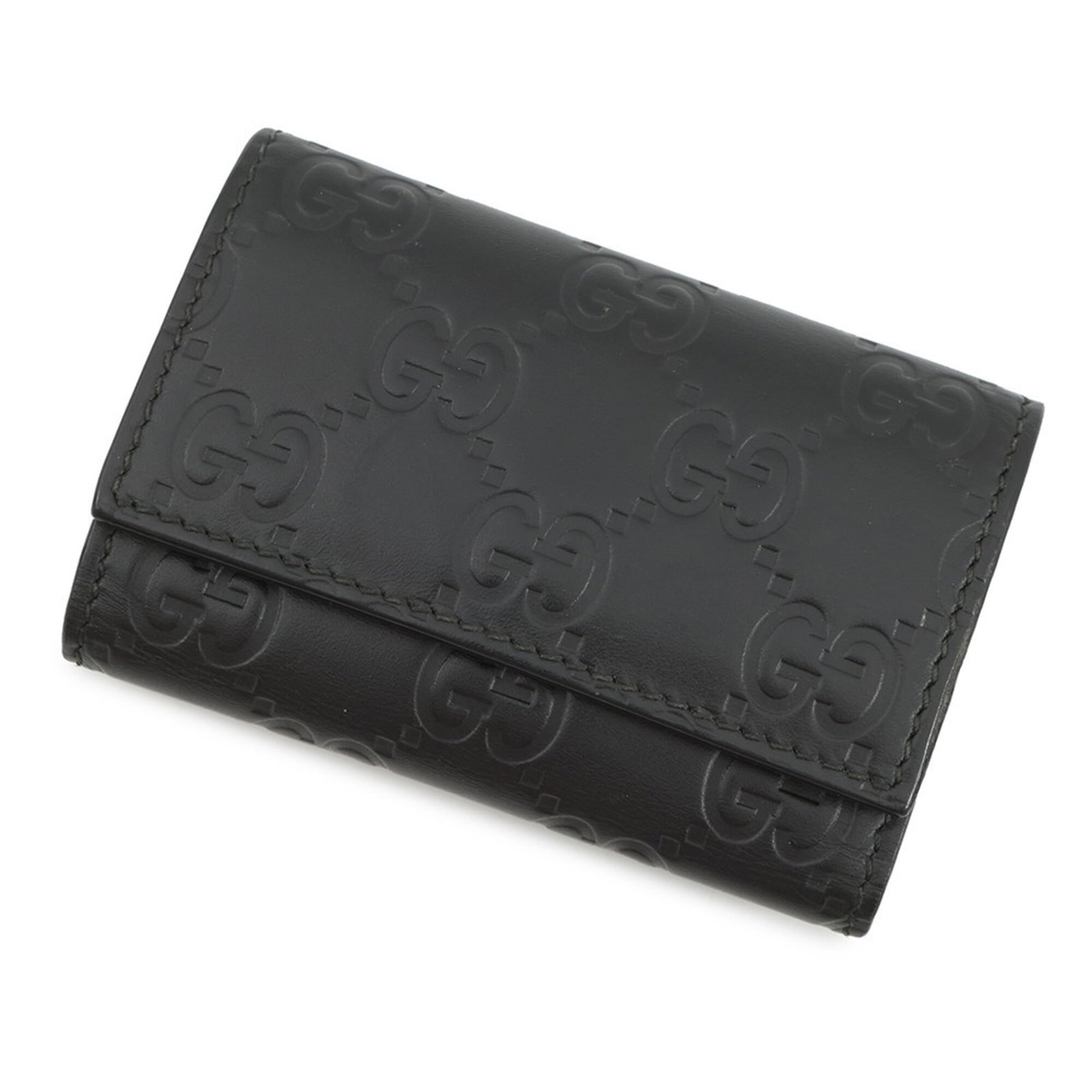 Keycase Leather by Gucci: Keycase Leather by Gucci Black leather keycase by Gucci, measuring 6.5cm x 9.5cm with six key hooks, crafted from high-quality materials. This sleek and compact accessory features a classic design tha