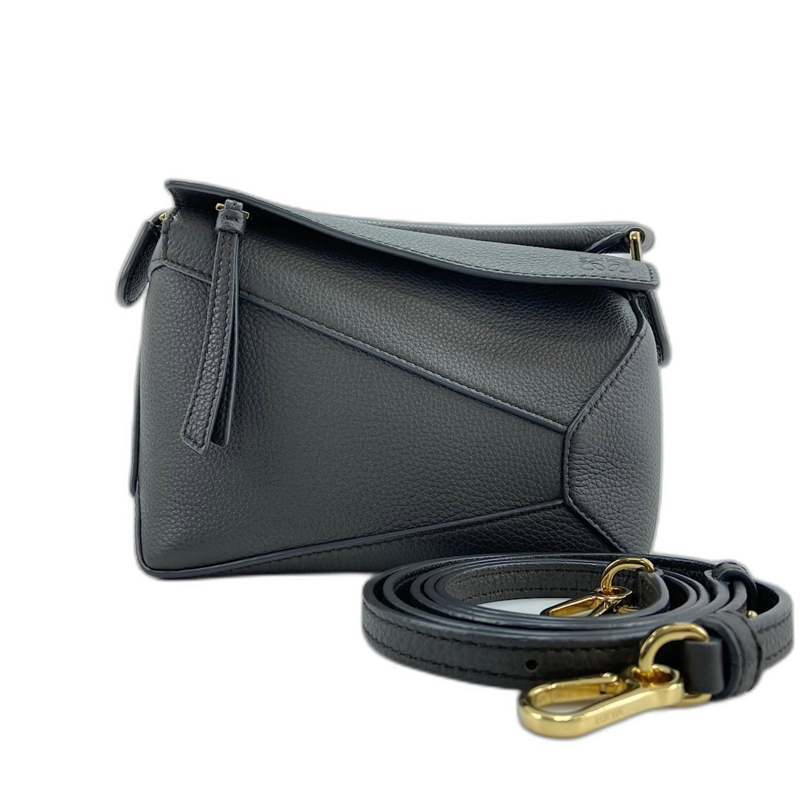 Loewe Handbag Leather: Loewe Handbag Leather Loewe Handbag Leather, Brown. Made from high-quality leather, this handbag measures 13cm x 17cm x 8cm and features adjustable straps that can be customized to fit your style. The
