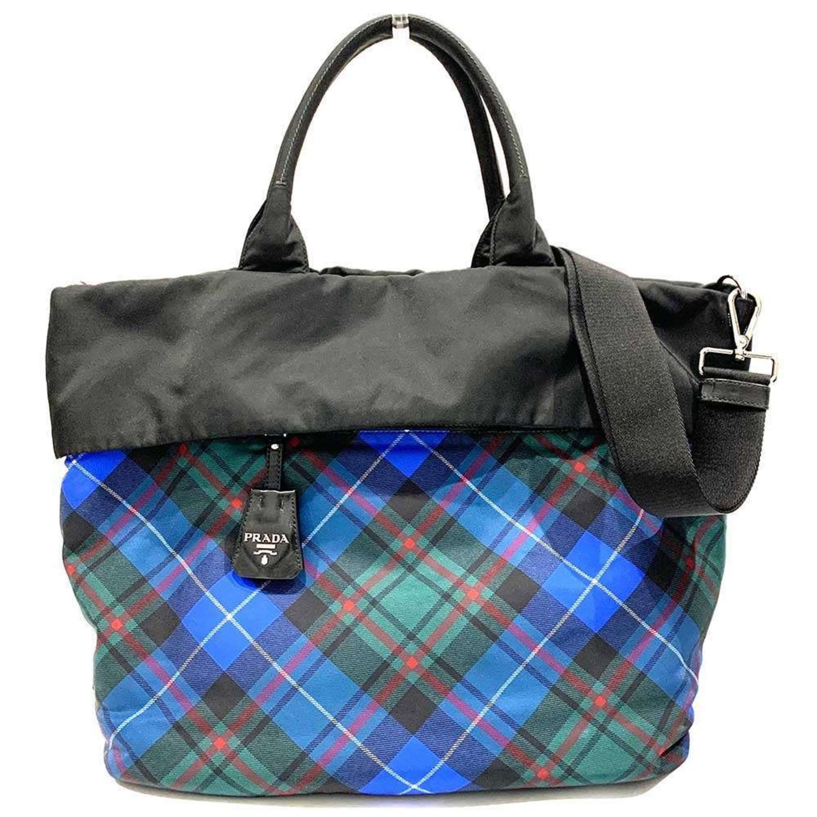Nylon leather shoulder handbag by Prada: Nylon leather shoulder handbag by Prada Nylon leather shoulder handbag by Prada, featuring a sleek black and blue color combination. This stylish bag measures 34cm x 50cm x 18cm and comes with a