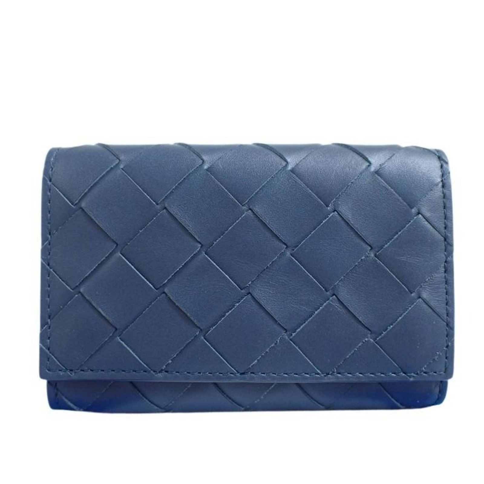 Keycase Leather By Veneta Bottega: Keycase Leather By Veneta Bottega Navy leather keycase from Bottega Veneta, made in Italy with a sleek design and compact size. The case measures 7.5cm x 11cm x 1.5cm and features high-quality leather
