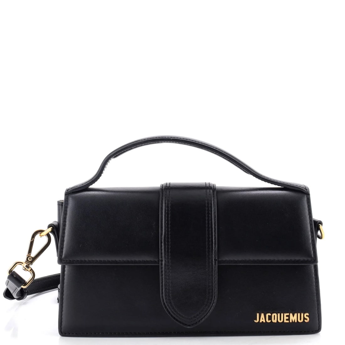 Leather flap bag bambino grand by Jacquemus: Leather flap bag bambino grand by Jacquemus Black leather flap bag with gold hardware, featuring a neutral interior and measuring approximately 4.5" in height, 9" in width, and 3" in depth. The bag ha