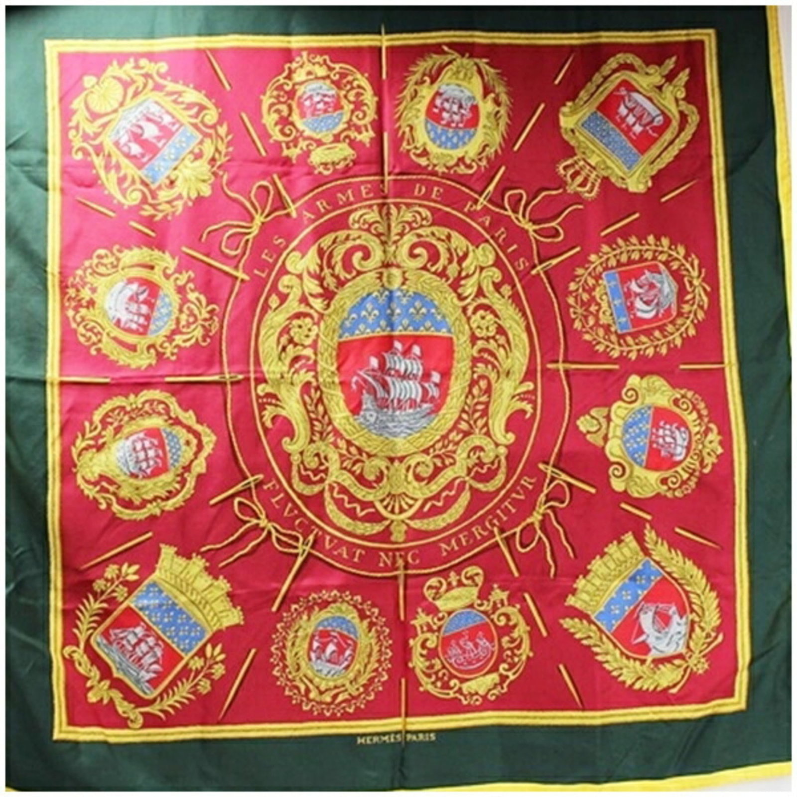 Hermes Scarf: Hermes Scarf 90cm x 90cm silk scarf in vibrant green and bold red hues, characteristic of the iconic Hermes style. This luxurious accessory features a classic design with clean lines and minimal