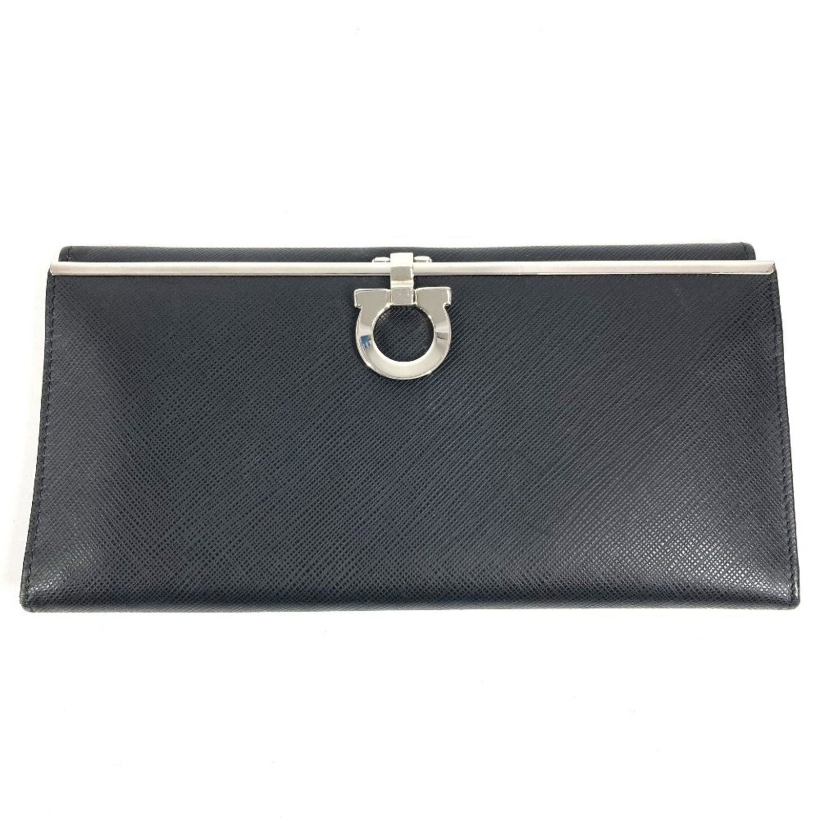 Long Wallet Ferragamo Salvatore Bi Fold Leather: Long Wallet Ferragamo Salvatore Bi Fold Leather The Salvatore Ferragamo long wallet features sleek black leather with silver accents, measuring 9.5cm x 19cm in size. This bi-fold design provides a
