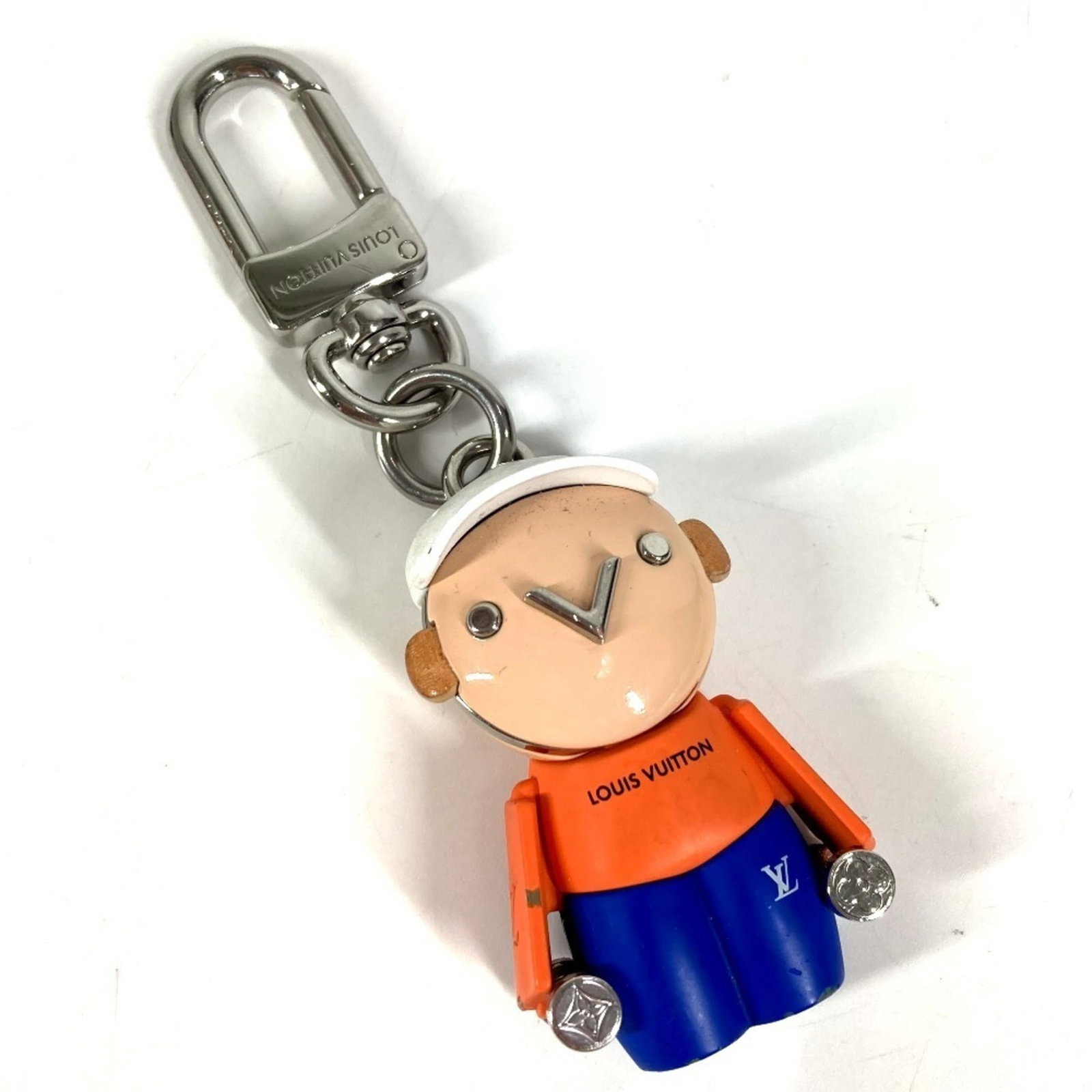 Keyring Metal By Louis Vuitton: Keyring Metal By Louis Vuitton Metal by Louis Vuitton keyring in blue and white, crafted from high-quality metal. This stylish accessory features the iconic brand's signature monogram pattern, adding 