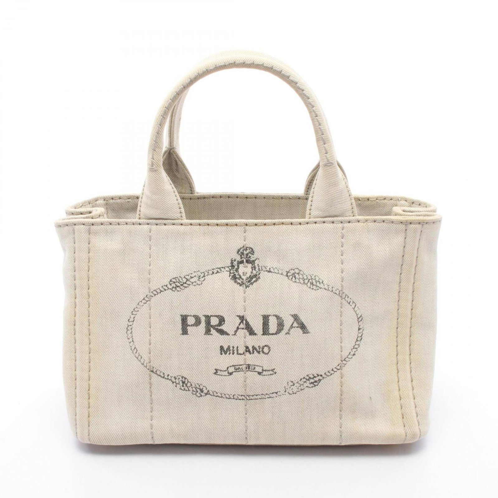 Canvas bag tote handbag by Prada: Canvas bag tote handbag by Prada Canvas bag tote handbag by Prada, featuring a timeless gray color and classic design. This versatile tote measures 19cm x 29cm x 15cm and offers a stylish way to carry