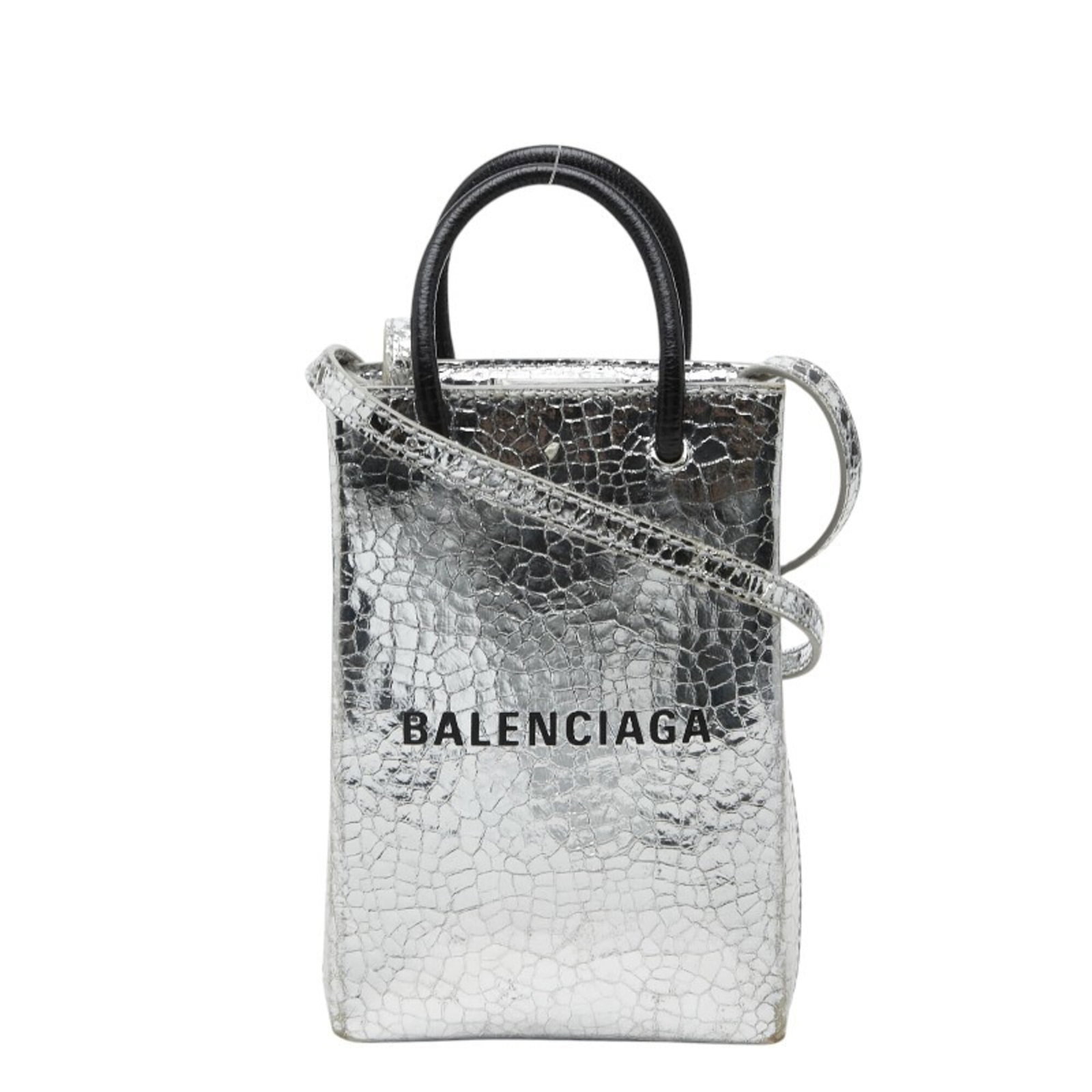 Balenciaga Handbag Shoulder Bag Leather: Balenciaga Handbag Shoulder Bag Leather This black leather shoulder bag from Balenciaga features sleek silver accents and a sophisticated design. Made from high-quality leather, it measures 18cm x 12c
