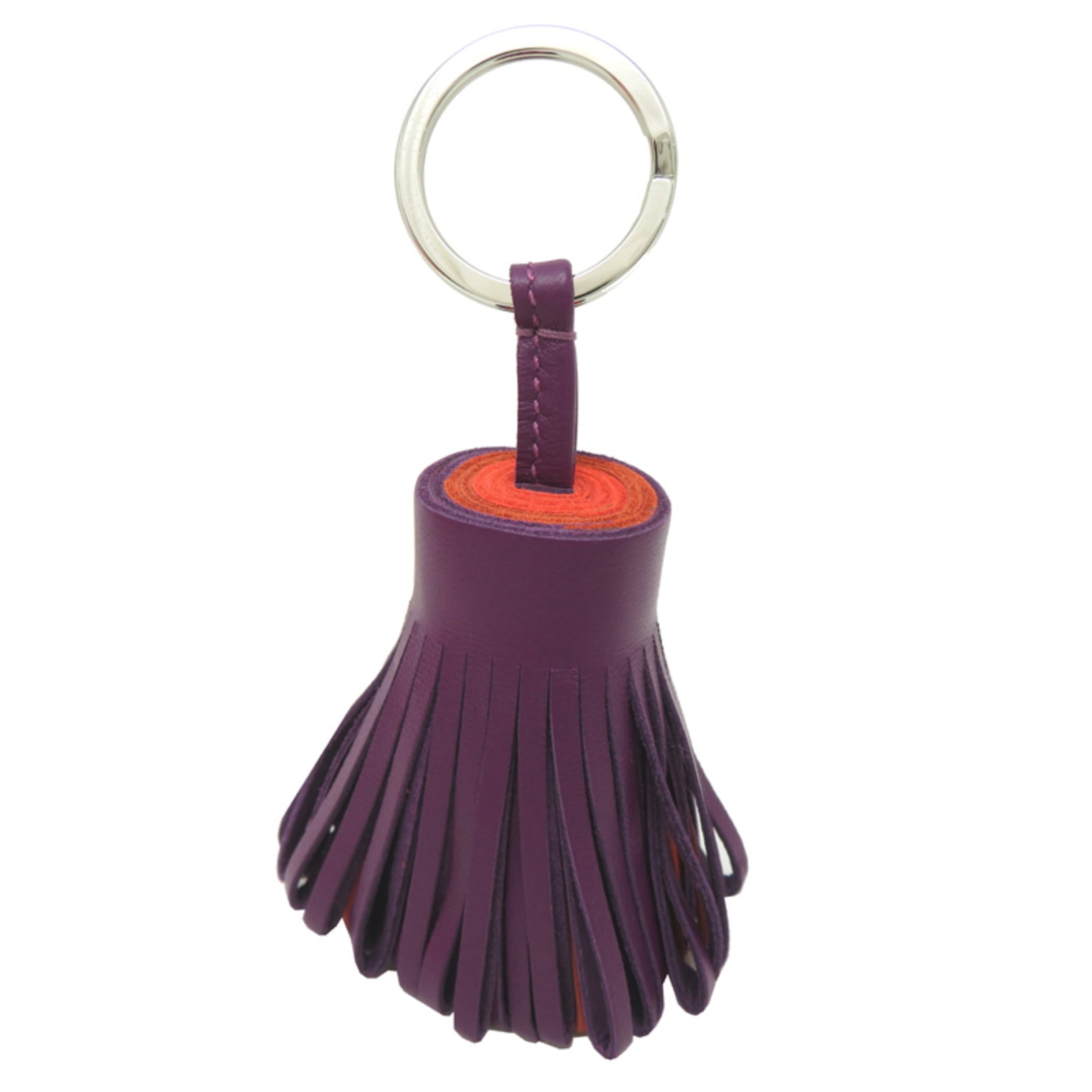 Keyring Hermes Leather: Keyring Hermes Leather This Hermes leather keyring boasts vibrant orange and purple hues, showcasing the brand's signature style. Made from high-quality leather, its compact size makes it a stylish