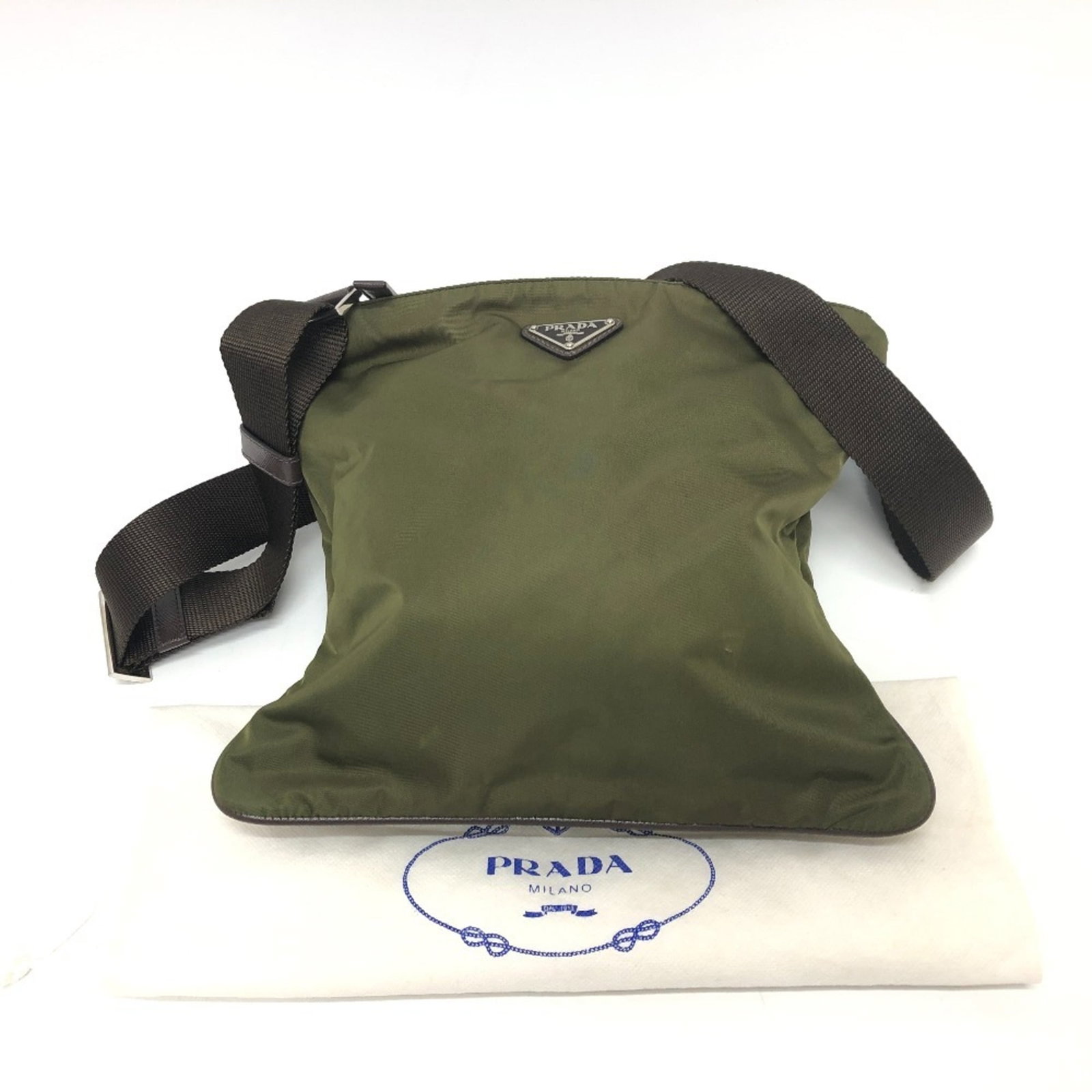 Shoulder Bag Nylon Prada: Shoulder Bag Nylon Prada Nylon Prada Triangle Logo Crossbody Shoulder Bag. This khaki-colored shoulder bag features a silver zipper closure, adjustable strap, and a single zipper pocket for added