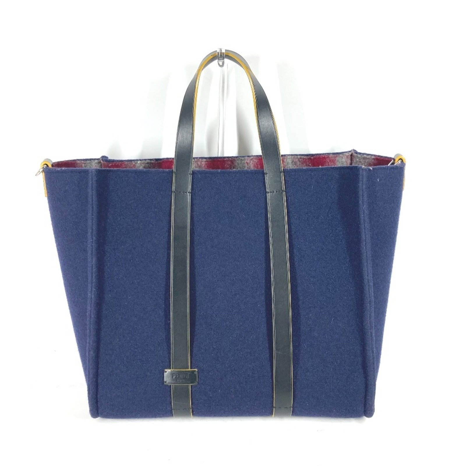 Fendi Shoulder Bag Tote Bag Wool: Fendi Shoulder Bag Tote Bag Wool Navy wool Fendi shoulder bag tote features an open outer pocket with a zipper closure, showcasing its functional design. Made from high-quality wool, the bag boasts a 