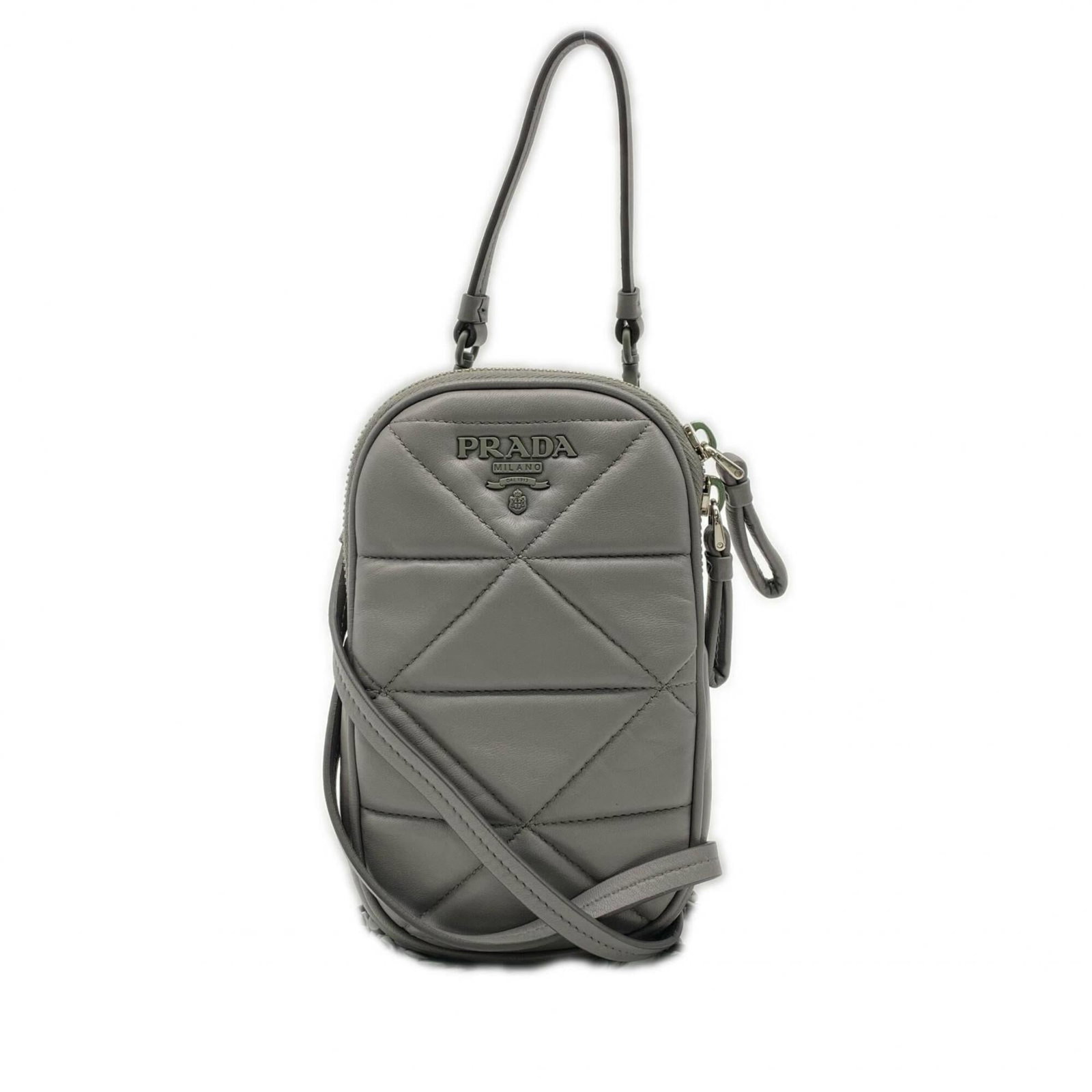 Shoulder Bag Leather by Prada: Shoulder Bag Leather by Prada Prada's gray leather shoulder bag features a sleek design with a zipper closure and RFID-enabled serial number on the body. The lambskin material provides a luxurious fee