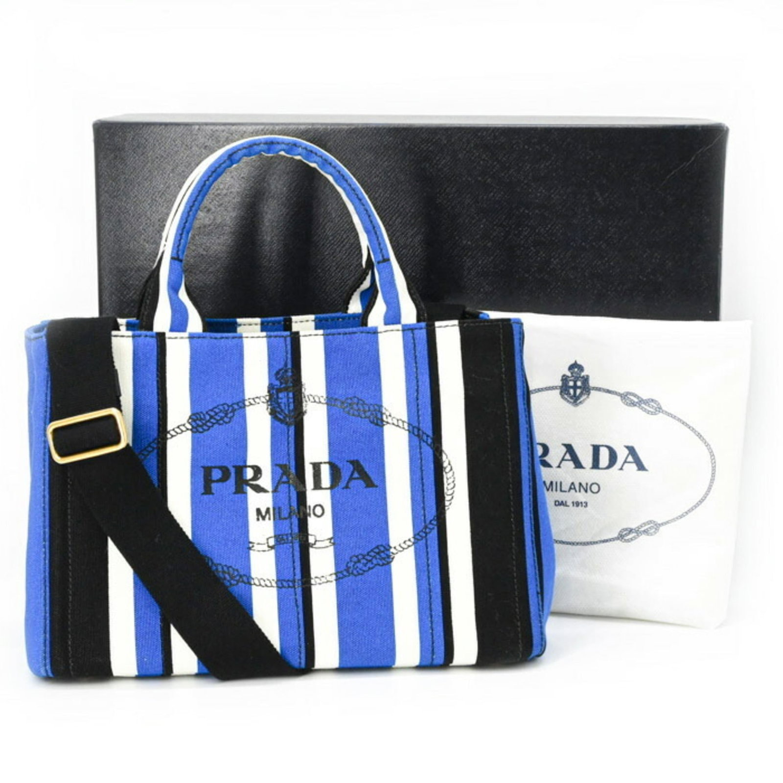 Handbag Canvas by Prada: Handbag Canvas by Prada Canvas by Prada, a sleek and versatile handbag in black canvas. Measuring 20cm x 28cm x 15cm, it boasts a compact size perfect for everyday use. With its simple yet stylish des