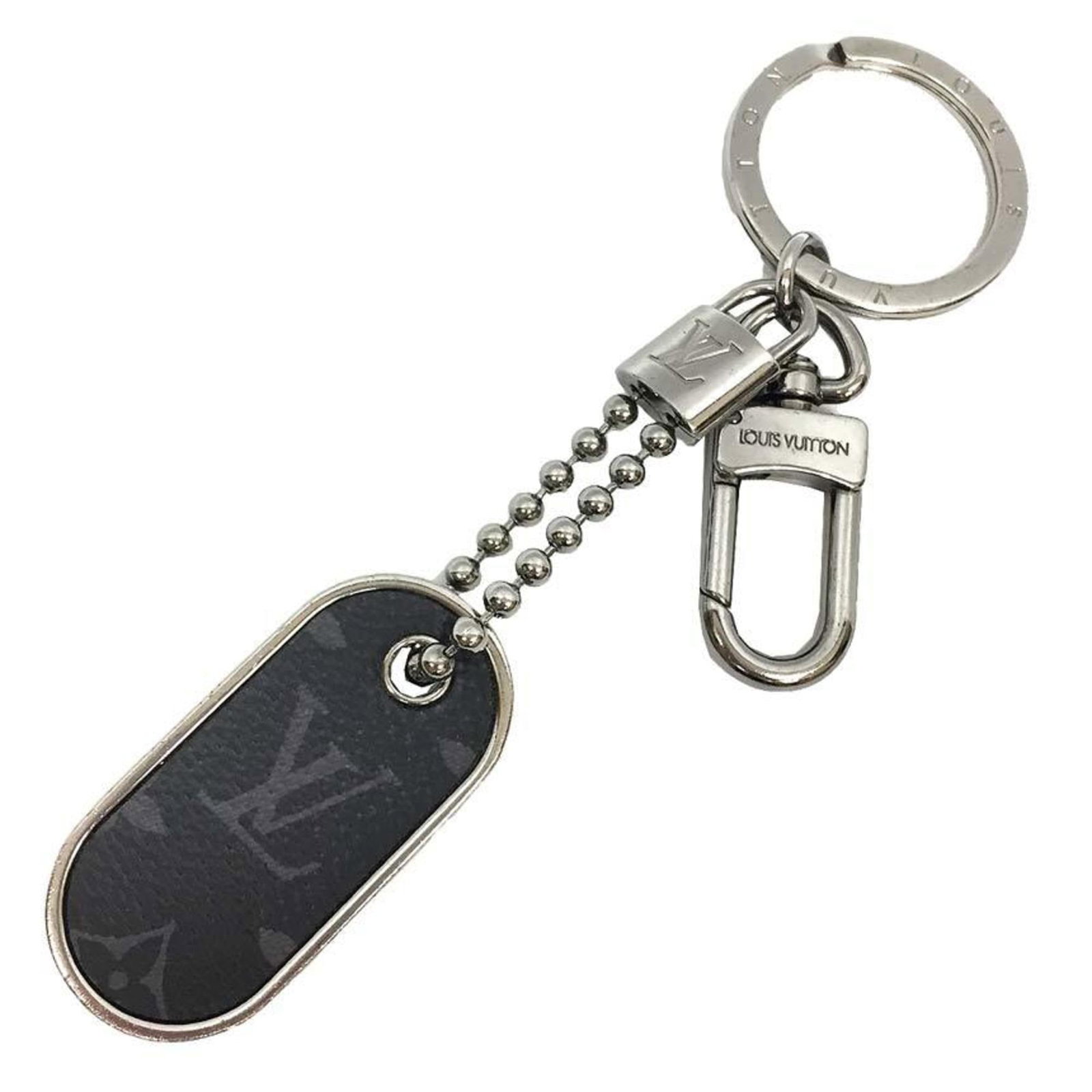 Keyring Metal By Louis Vuitton: Keyring Metal By Louis Vuitton Metal keyring from Louis Vuitton in black and silver. This metal accessory bears the iconic brand's signature style, making it a stylish addition to any keychain. A simp
