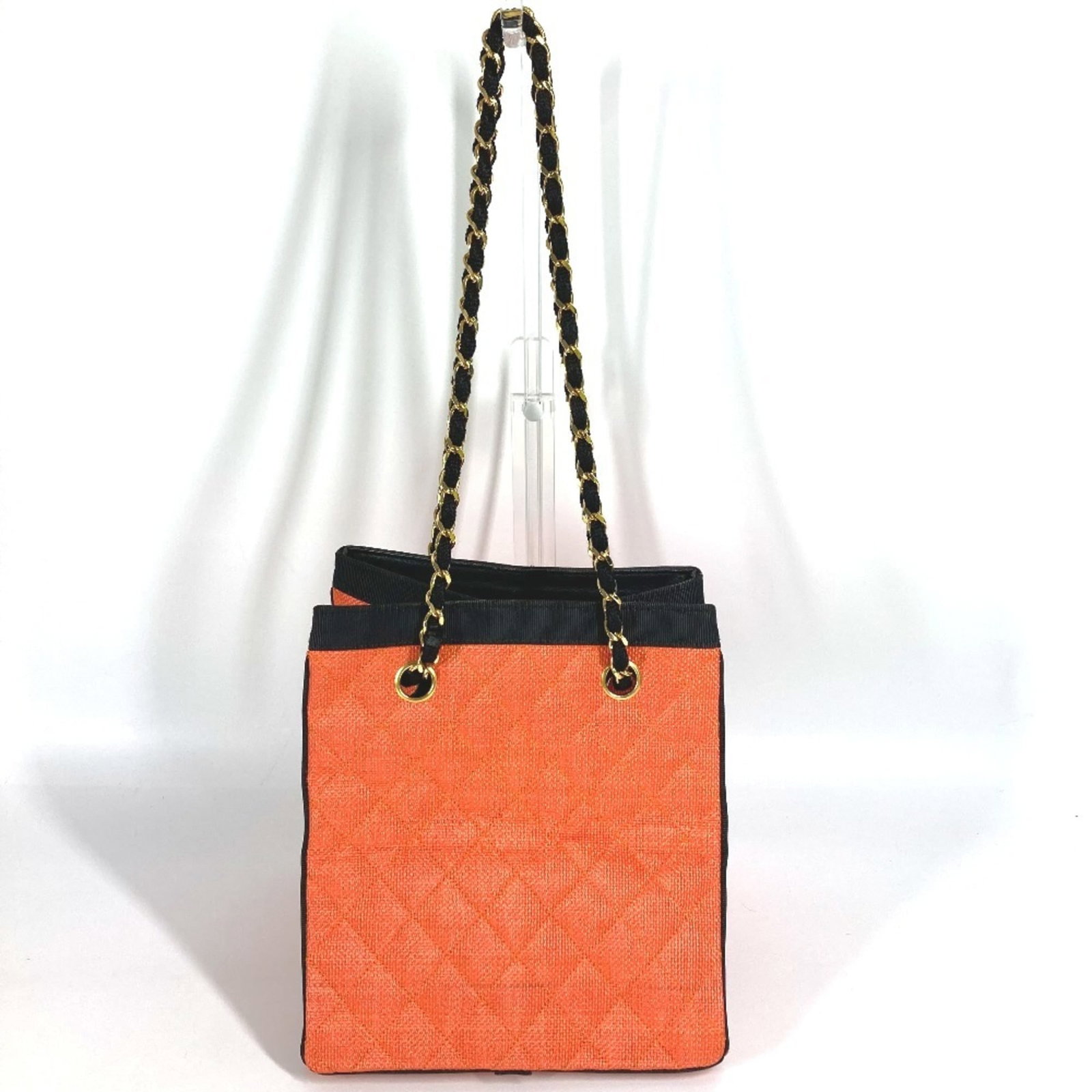 Straw leather bag tote from chanel: Straw leather bag tote from chanel Straw leather bag tote from Chanel, featuring a classic design with a black and orange color combination. Made in France, this shoulder bag boasts a unique straw