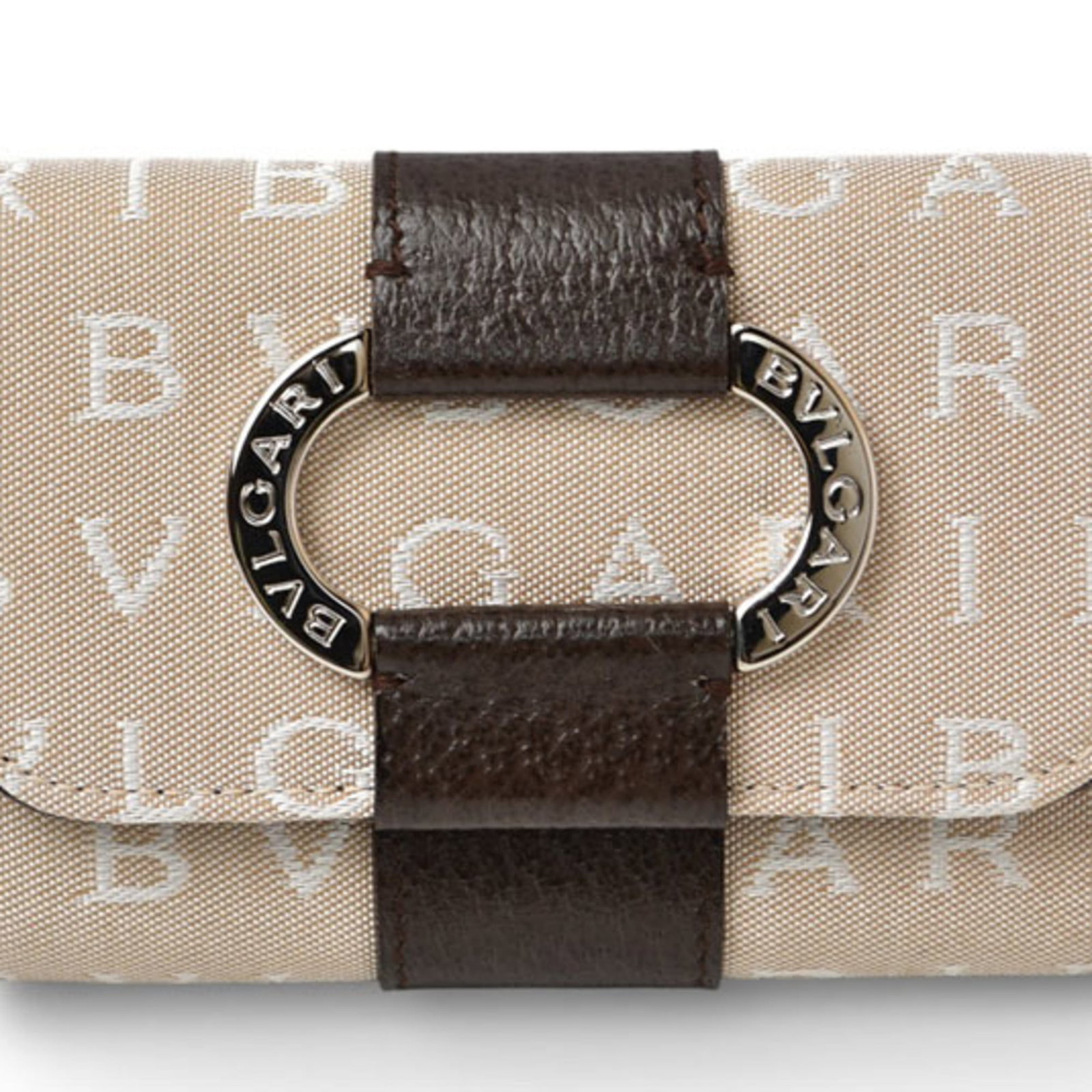 Canvas leather keycase by Bvlgari: Canvas leather keycase by Bvlgari Canvas leather keycase by Bvlgari, featuring a sleek beige design and 6 spacious key hooks. Made from high-quality canvas and leather materials, this stylish accessor
