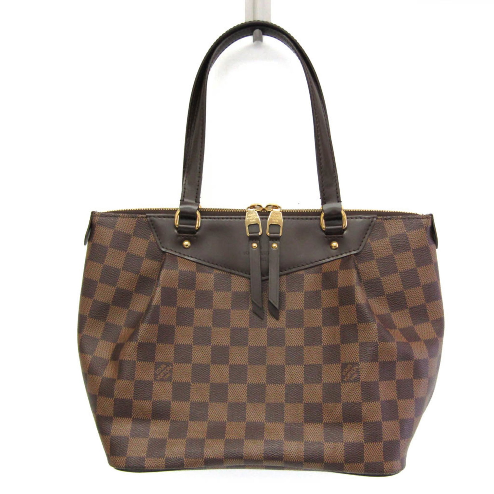 Shoulder Bag Damier Canvas by Louis Vuitton: Shoulder Bag Damier Canvas by Louis Vuitton Damier Canvas by Louis Vuitton - A Timeless Shoulder Bag. This iconic shoulder bag features the classic Damier pattern in brown Ebene, with a sturdy zipper 