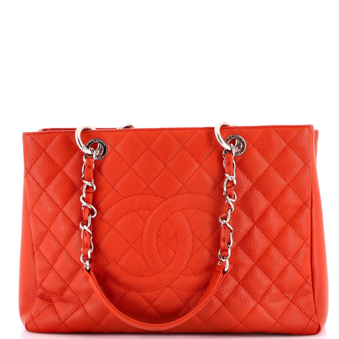 Caviar Quilted Shopping Tote Chanel: Caviar Quilted Shopping Tote Chanel Red quilted caviar leather shopping tote with satin gray interior, featuring silver hardware and classic Chanel design. The exterior shows signs of wear, including 