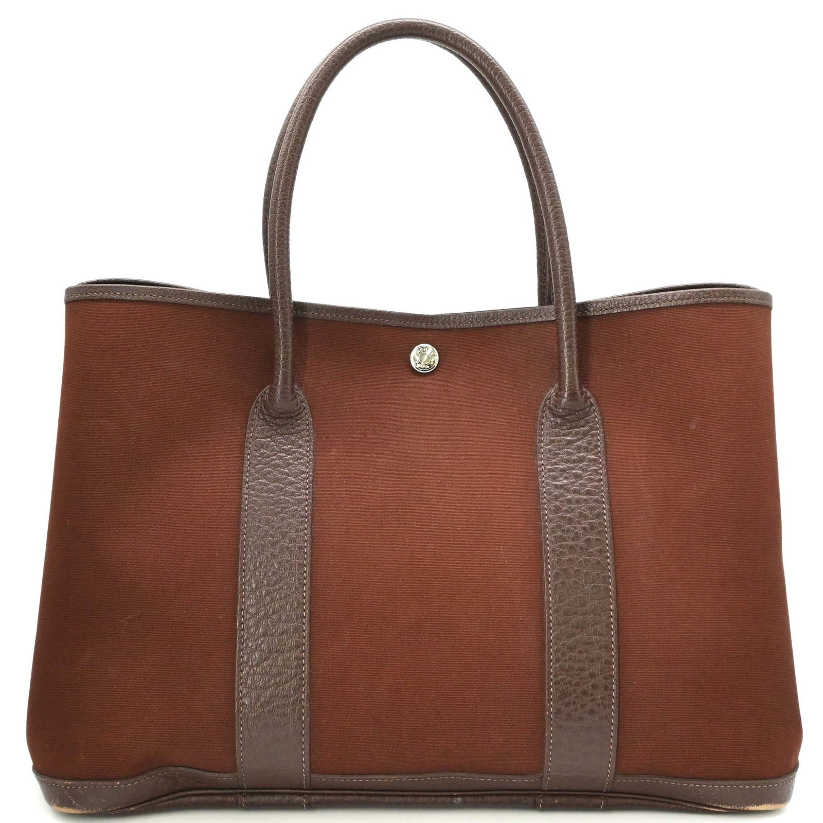Hermes Handbag Toile Officier Leather: Hermes Handbag Toile Officier Leather Toile Officier leather adds a touch of classic French elegance to this Herm?s handbag, crafted from high-quality brown leather. Measuring 26cm x 36cm x 17cm, the 