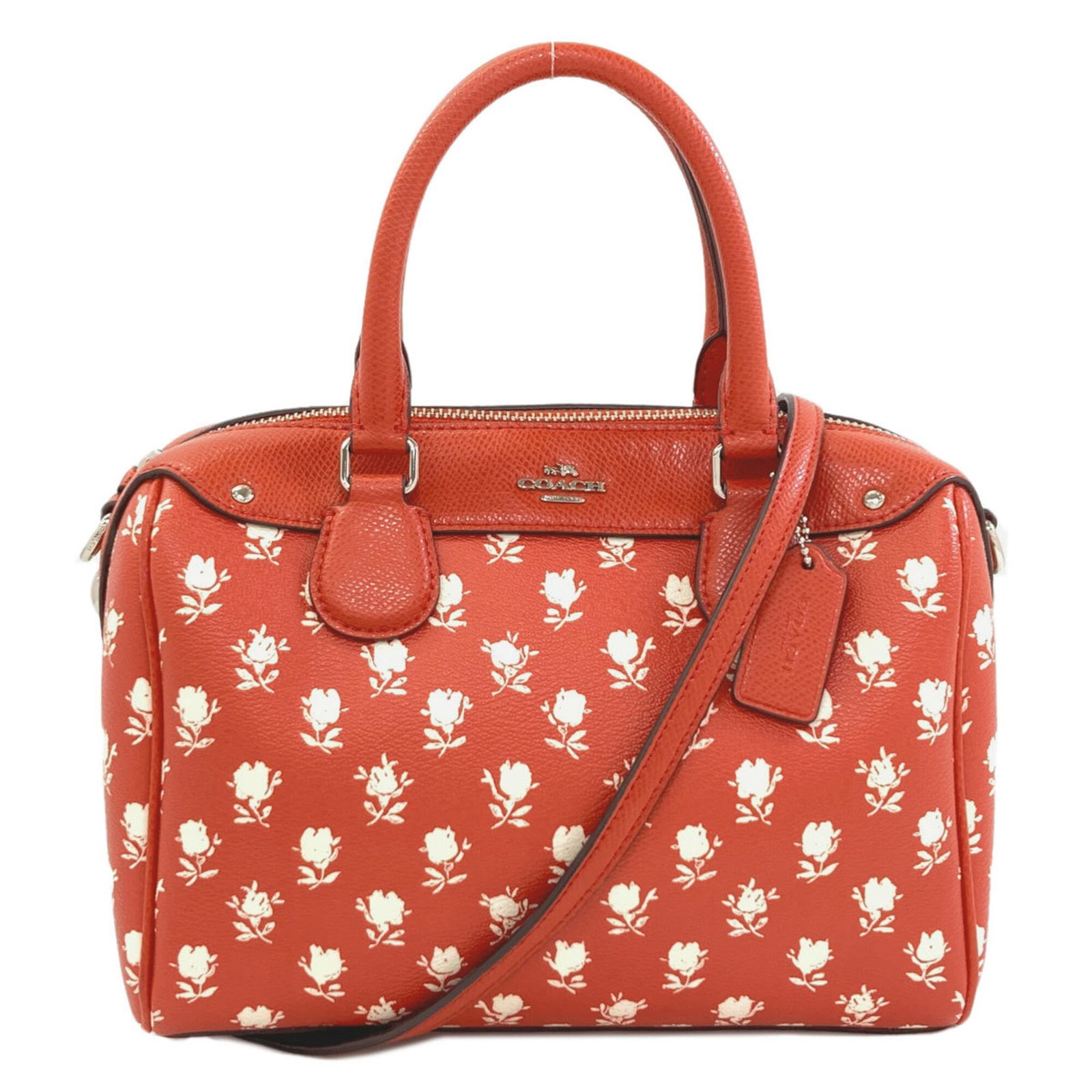 Coach Handbag Pvc: Coach Handbag Pvc This Coach handbag features a striking red PVC material, showcasing a unique and eye-catching design. With its compact size and sleek shape, it's perfect for adding a pop of color